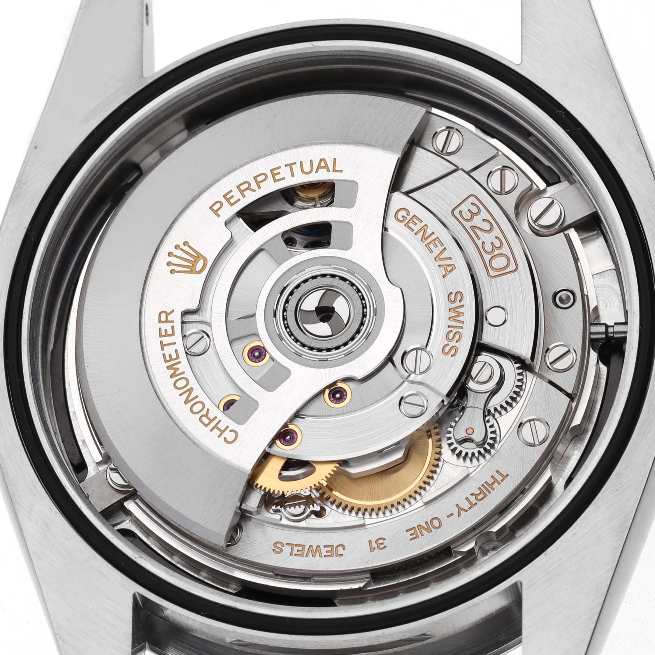 The image shows the Rolex Oyster Perpetual M124300-0002 Mens Stainless Steel Black Dials movement from the back, highlighting its intricate mechanical parts.