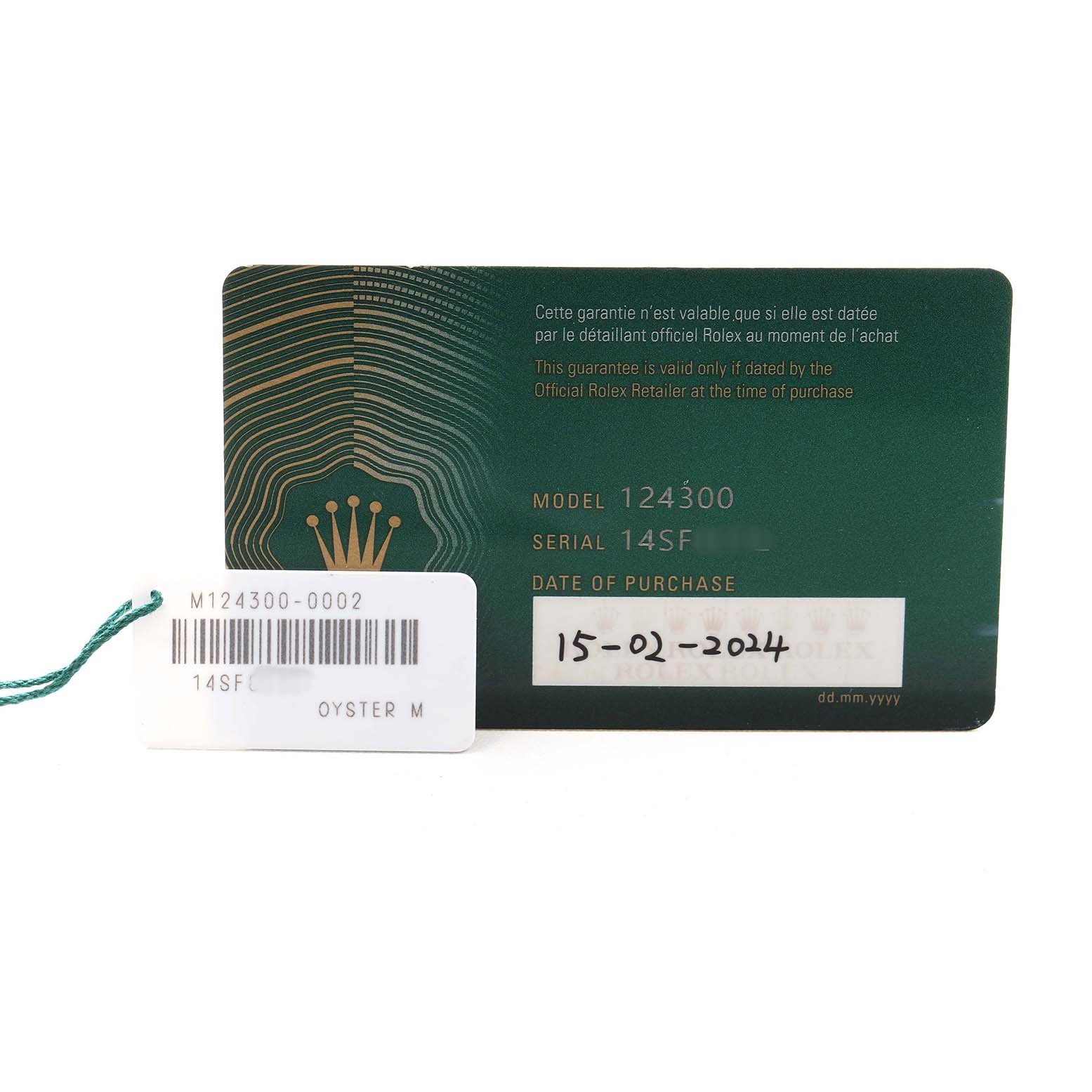 The image shows the warranty card and tag for a Rolex Oyster Perpetual M124300-0002 Mens Stainless Steel Black Dial model 124300, with the serial number and purchase date visible.