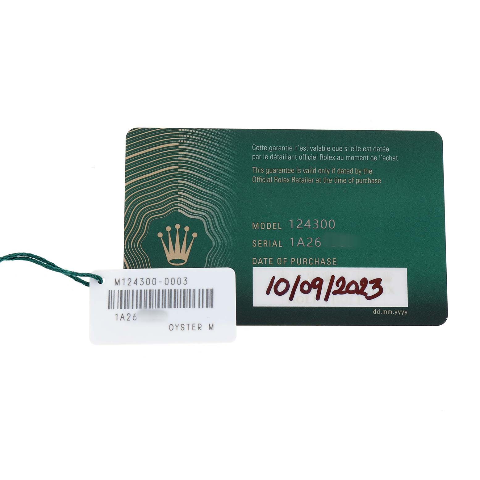 The image shows a guarantee card and tag for a Rolex Oyster Perpetual 124300 Men's Stainless Steel Blue Dial model 124300, including purchase date and serial number.