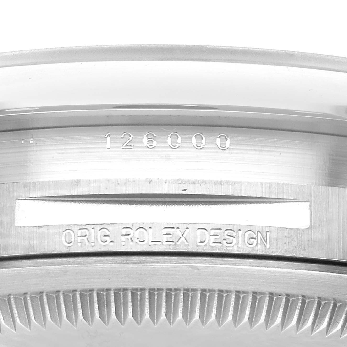 This image shows a close-up of the case back and serial number of a Rolex Oyster Perpetual 126000 Men
s Stainless Steel Blue Dial 126000 Men
s Stainless Steel Blue Dial model.