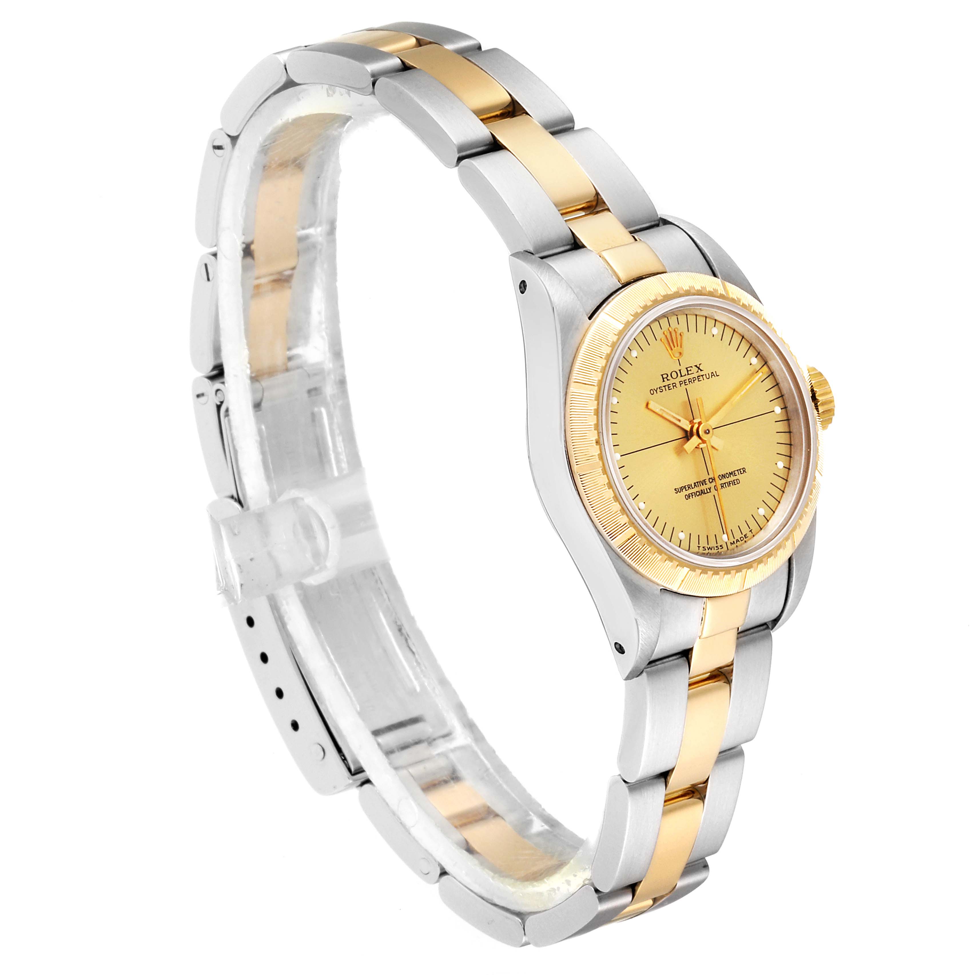This Rolex Oyster Perpetual 67243 Women
s Steel and Gold (two tone) Champagne Dial 67243 Women
s Steel and Gold (two tone) Champagne Dial watch is displayed at a slight angle, highlighting the face, bezel, and partial bracelet.
