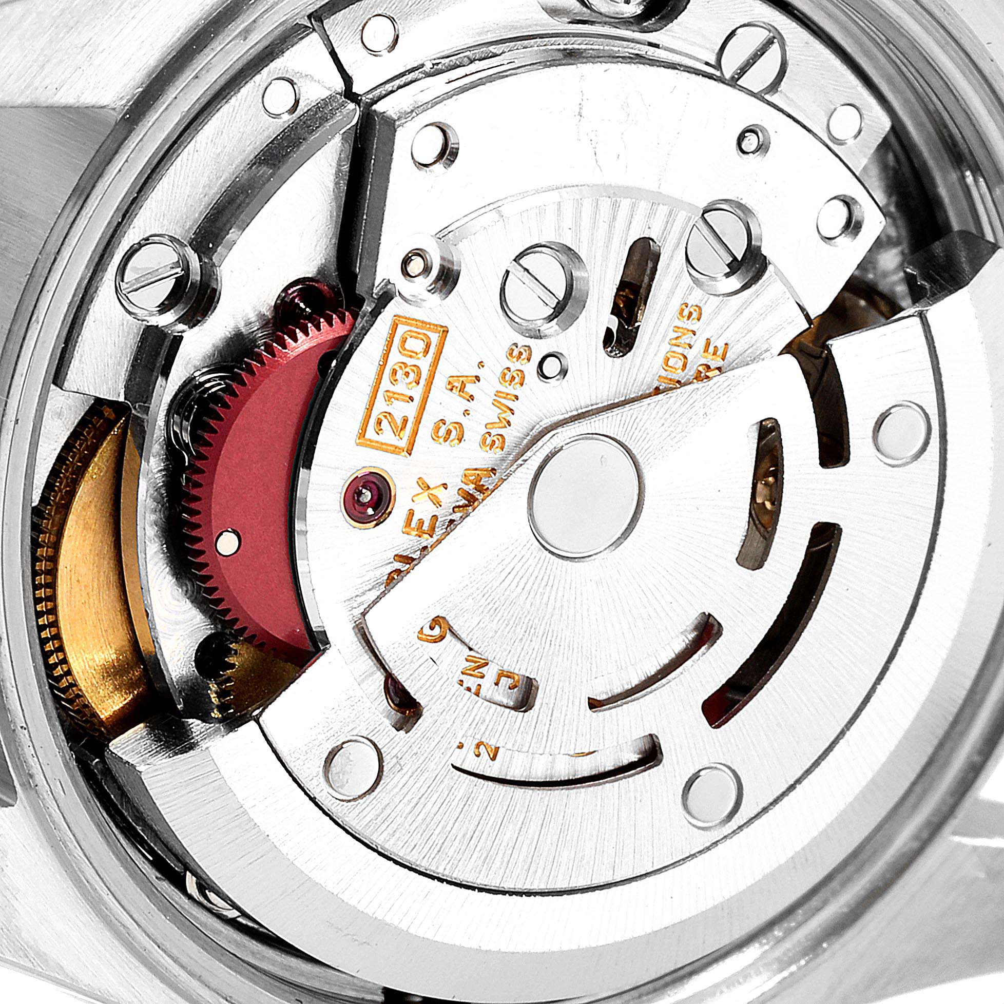 The image shows a close-up of the movement and inner mechanism of a Rolex Oyster Perpetual 67243 Women
s Steel and Gold (two tone) Champagne Dial 67243 Women
s Steel and Gold (two tone) Champagne Dial watch.