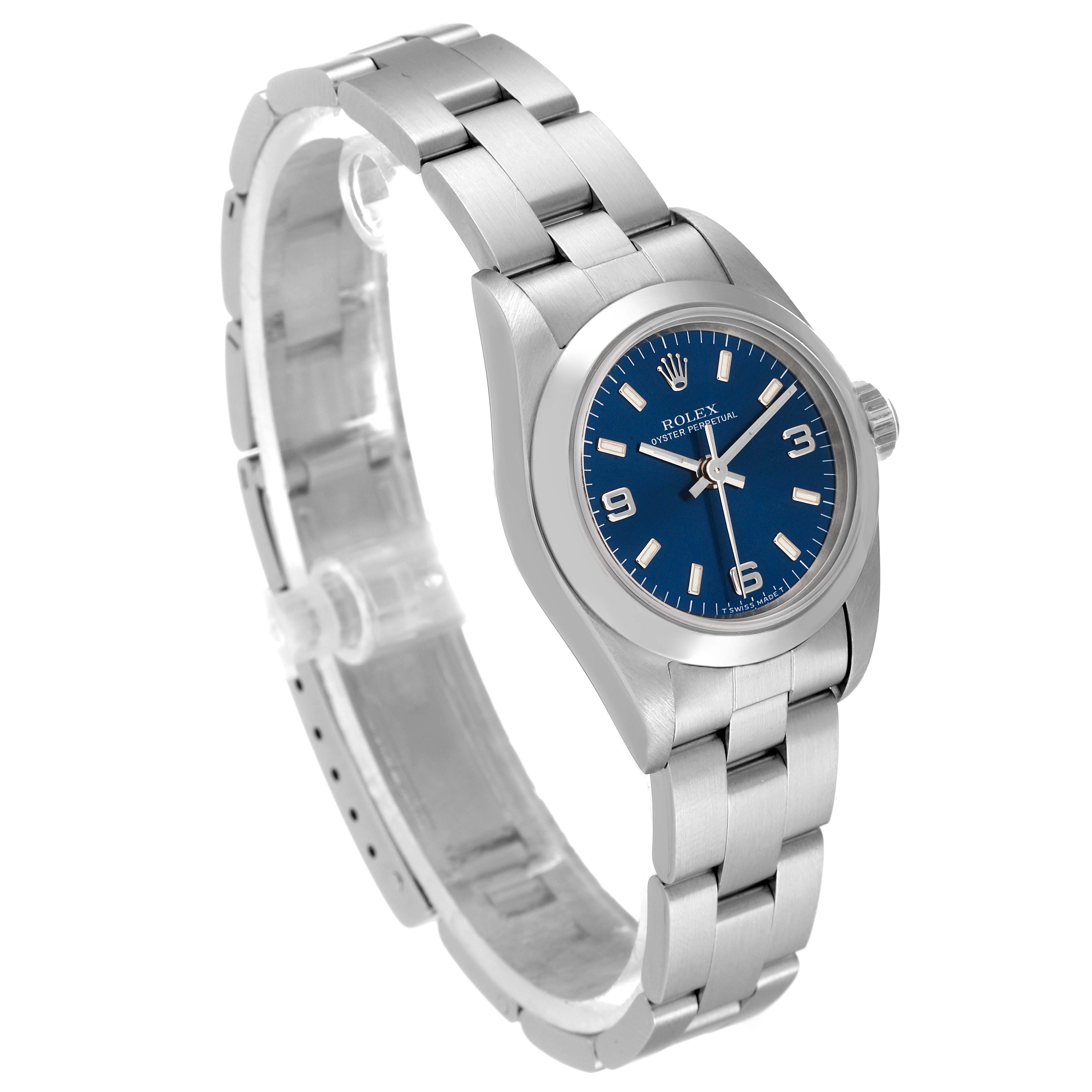 The Rolex Oyster Perpetual 67180 Women's Stainless Steel Blue Dial 67180 Women's Stainless Steel Blue Dial watch is shown at a slight left angle, highlighting the bracelet and blue dial.