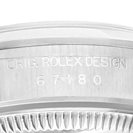The image shows a close-up of the case back of an Oyster Perpetual Rolex watch with engraved text "ORIG. ROLEX DESIGN" and numbers "67180."