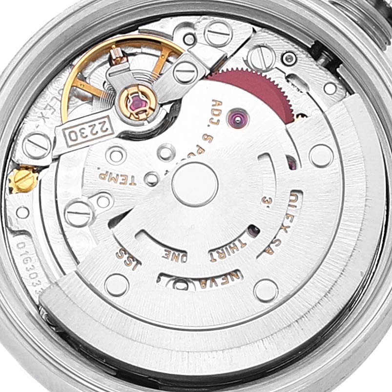 The image shows a close-up of the movement mechanism of the Rolex Oyster Perpetual 76030 Women
s Stainless Steel Pink Dial 76030 Women
s Stainless Steel Pink Dial watch.