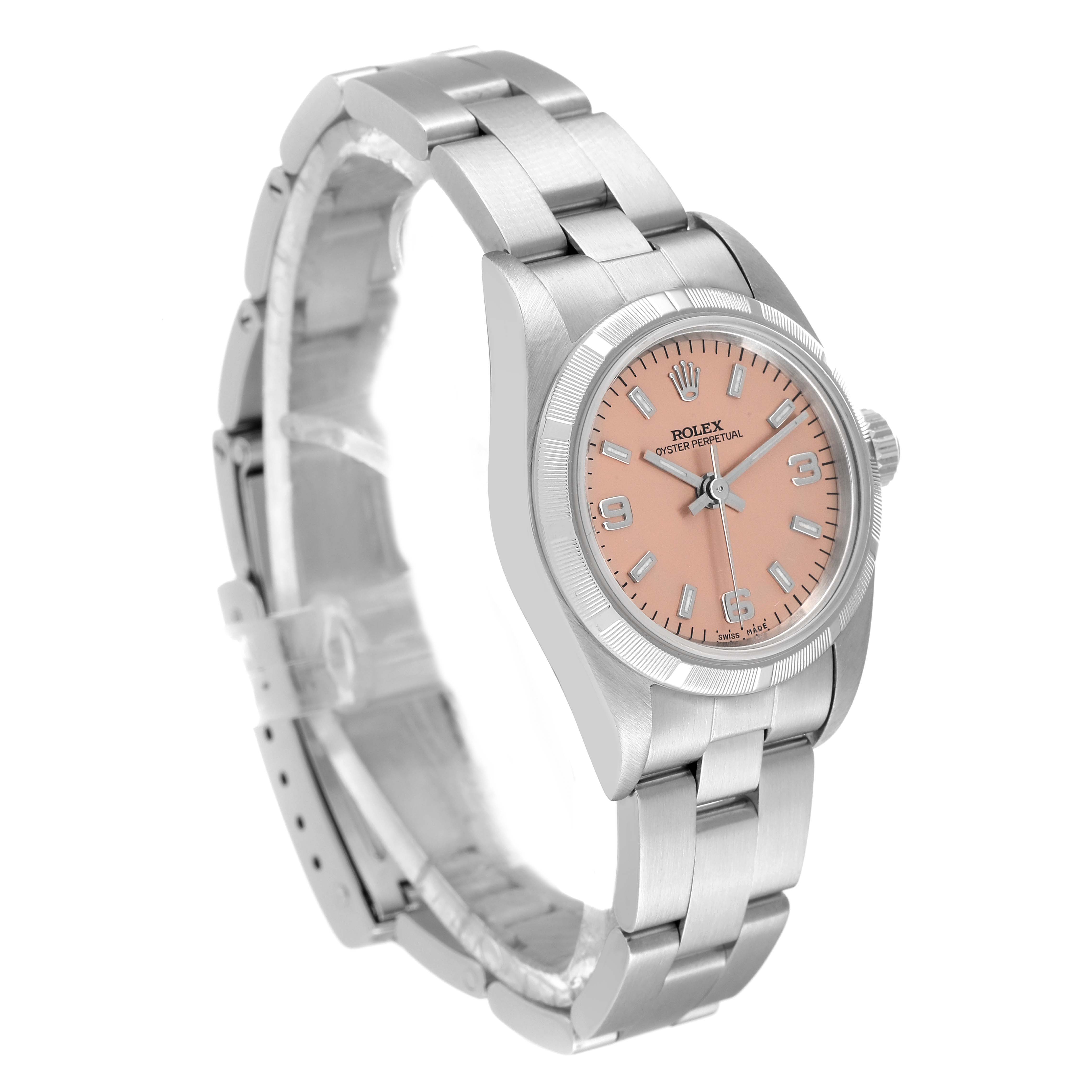 The Rolex Oyster Perpetual 76030 Women
s Stainless Steel Pink Dial 76030 Women
s Stainless Steel Pink Dial watch is shown at a three-quarter angle, displaying the bracelet, case, and pink dial.