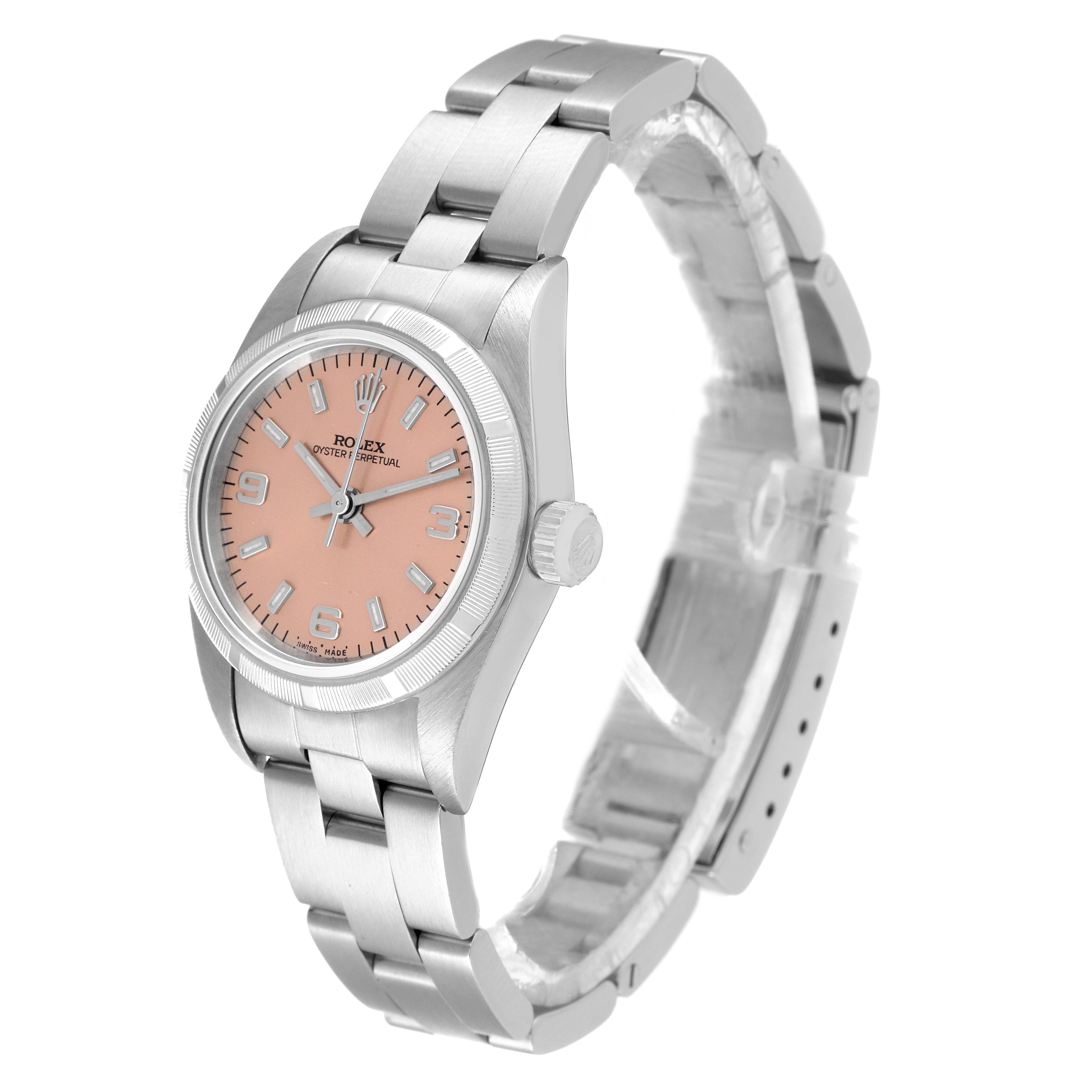 The image shows the side angle of a Rolex Oyster Perpetual 76030 Women
s Stainless Steel Pink Dial 76030 Women
s Stainless Steel Pink Dial watch, displaying the face, crown, and bracelet.