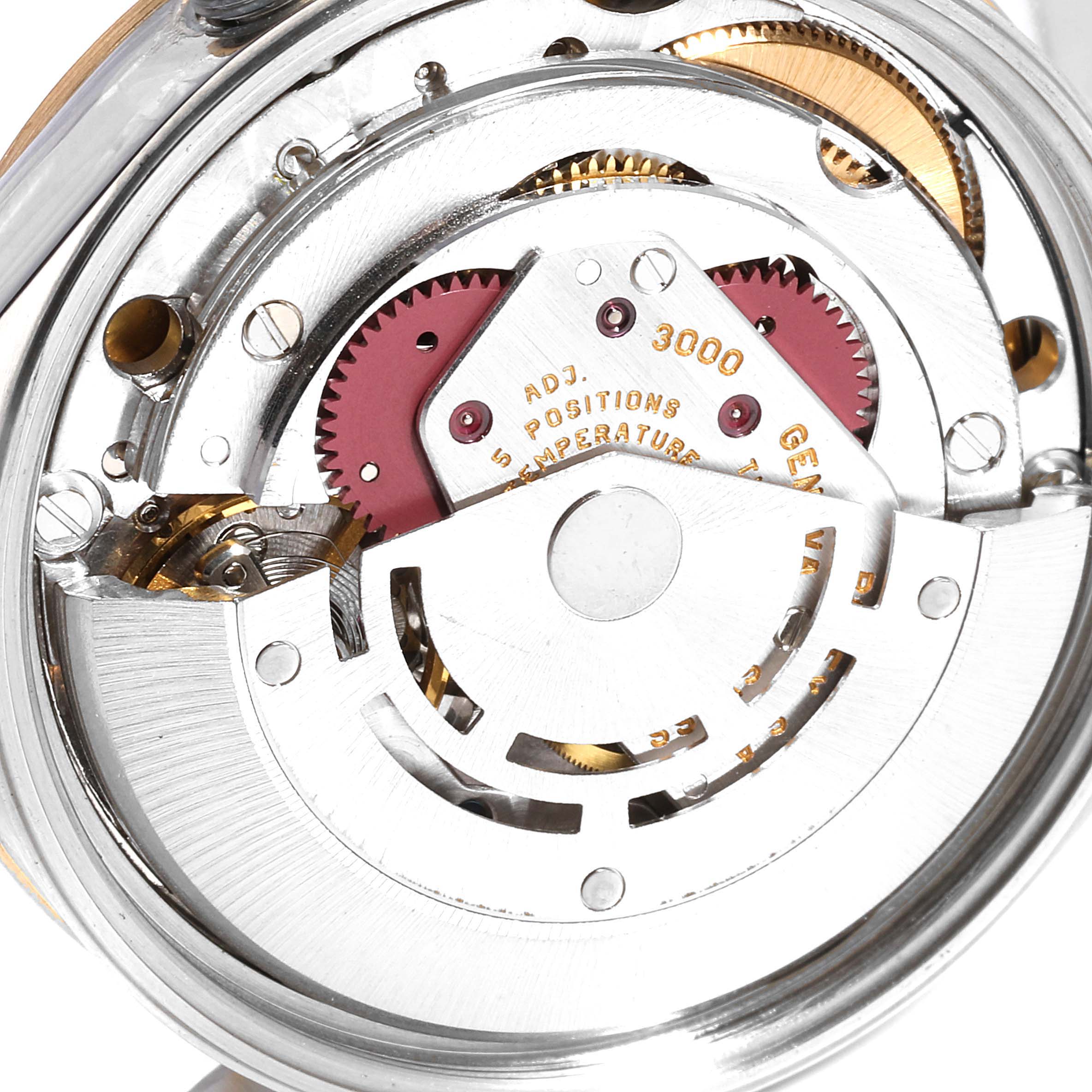 The image shows the intricate movement and internal mechanisms of a Rolex Oyster Perpetual 14203 Men's Steel and Gold (two tone) Blue Dial 14203 Men's Steel and Gold (two tone) Blue Dial watch.