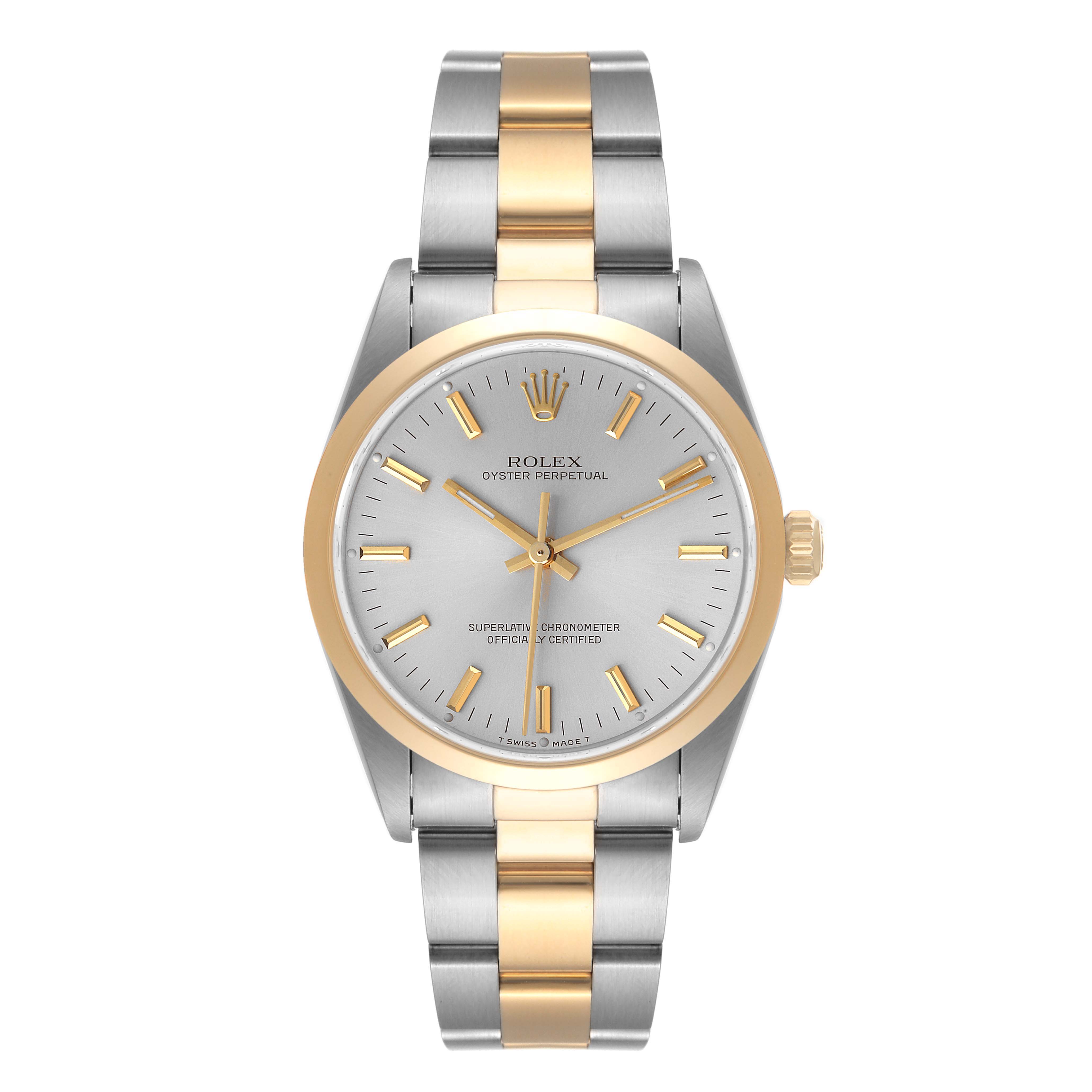 The Rolex Oyster Perpetual 14203 Men's Steel and Gold (two tone) Silver Dial 14203 Men's Steel and Gold (two tone) Silver Dial watch is shown from a top-down angle, highlighting its face, bezel, and two-tone bracelet.