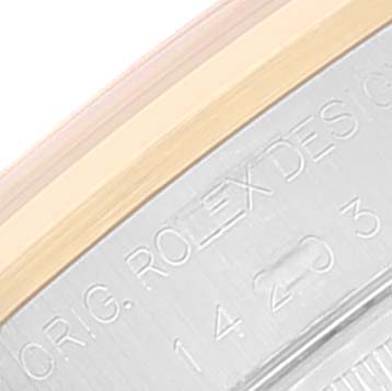 This image shows a close-up of the edge of the case back of a Rolex Oyster Perpetual 14203 Men's Steel and Gold (two tone) Silver Dial 14203 Men's Steel and Gold (two tone) Silver Dial watch, highlighting the engraved text.