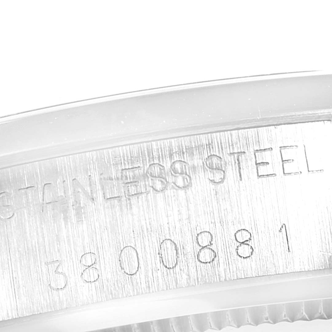 The image shows a close-up of the sides case of the Vintage Collection model watch by Rolex, specifically the engraved serial numbers.