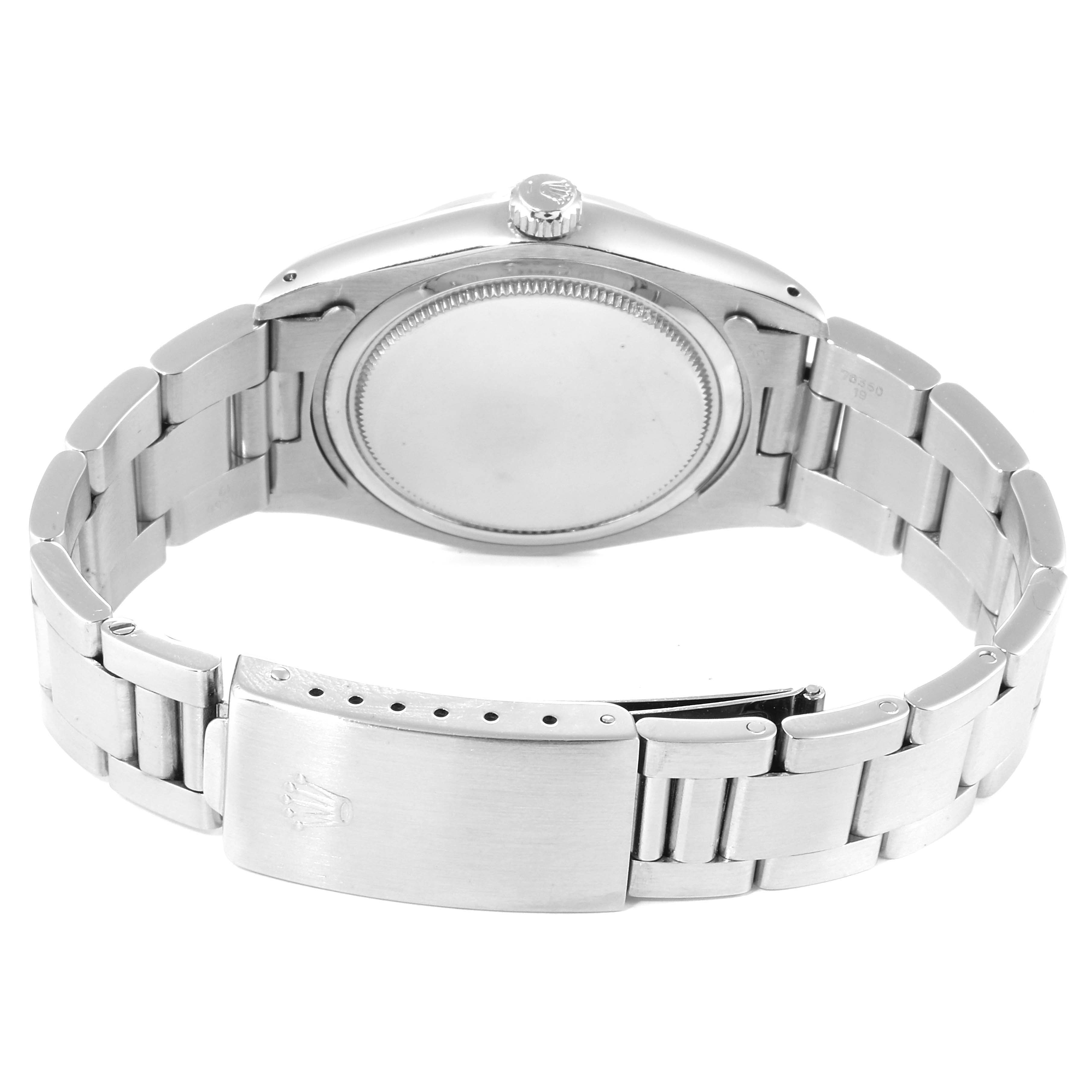The image shows the back case and bracelet of a Rolex Vintage Collection 6694 Men
s Stainless Steel Silver Dial 6694 Men
s Stainless Steel Silver Dial watch from a rear angle.