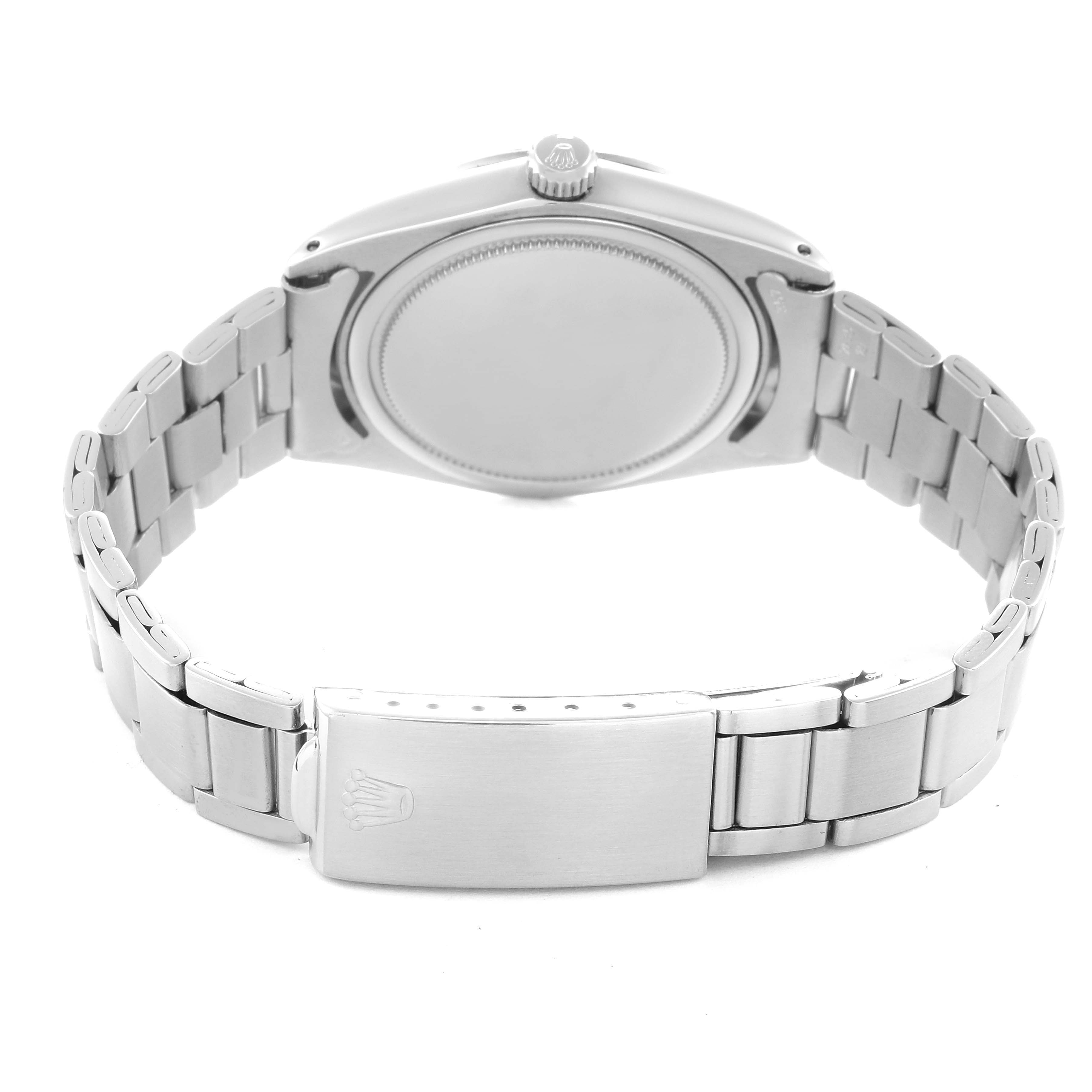 The Rolex Vintage Collection Men
s Stainless Steel Silver Dial Men
s Stainless Steel Silver Dial model is shown from the rear, displaying the case back, crown, and bracelet clasp.