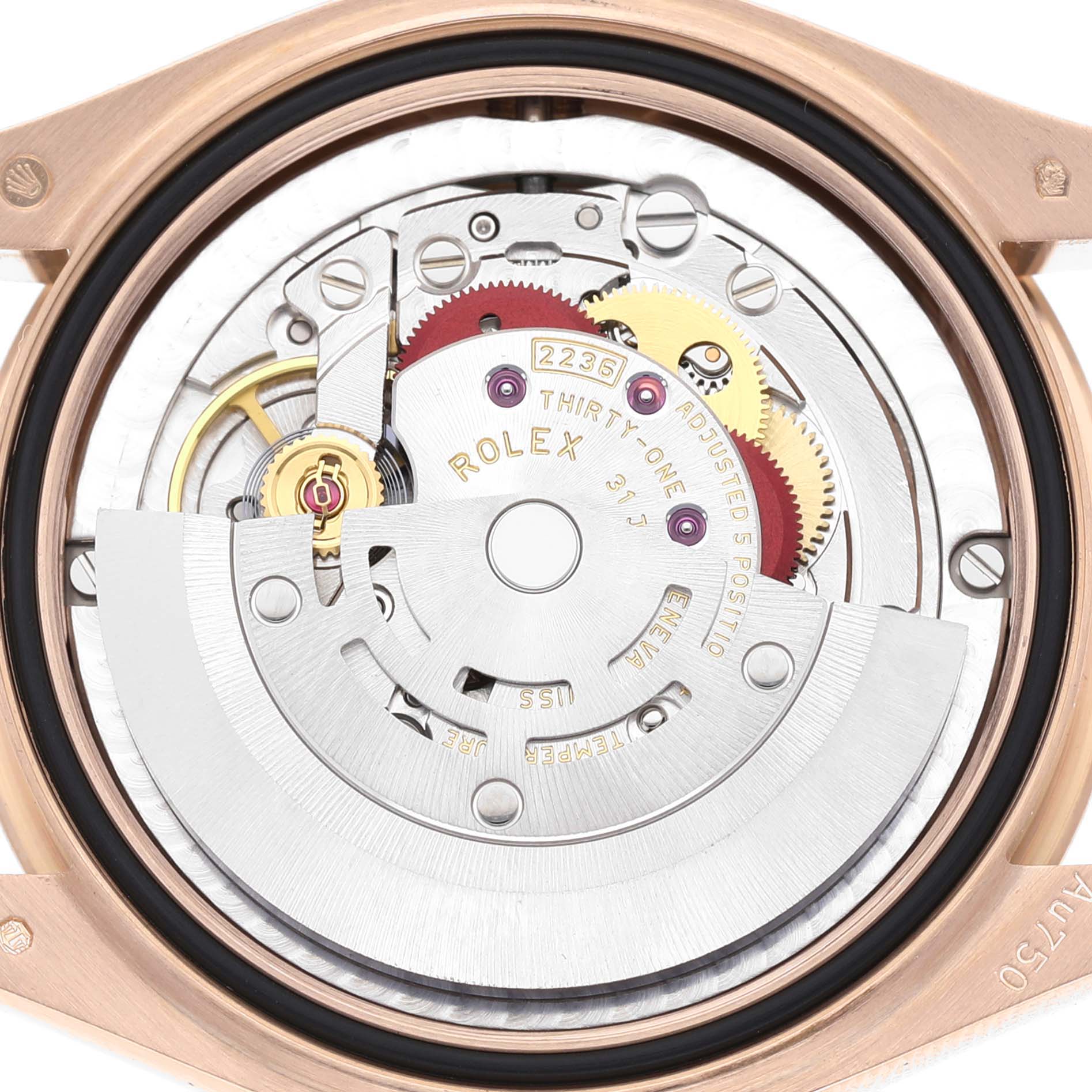 The image shows the detailed inner mechanism of a Rolex Mid-Size 278275 Women's Rose Gold Pink Dial watch, focusing on its movement components from a top-down angle.