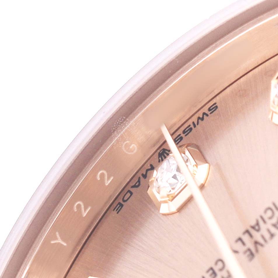 The image shows a close-up of the Rolex Mid-Size 278275 Women's Rose Gold Pink Dial watch dial, highlighting the markers and "Swiss Made" text.