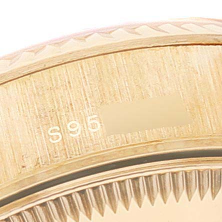 This close-up image of the Rolex President 69178 Women
s Yellow Gold Champagne Dial 69178 Women
s Yellow Gold Champagne Dial model shows part of the watch bezel and the case edge.