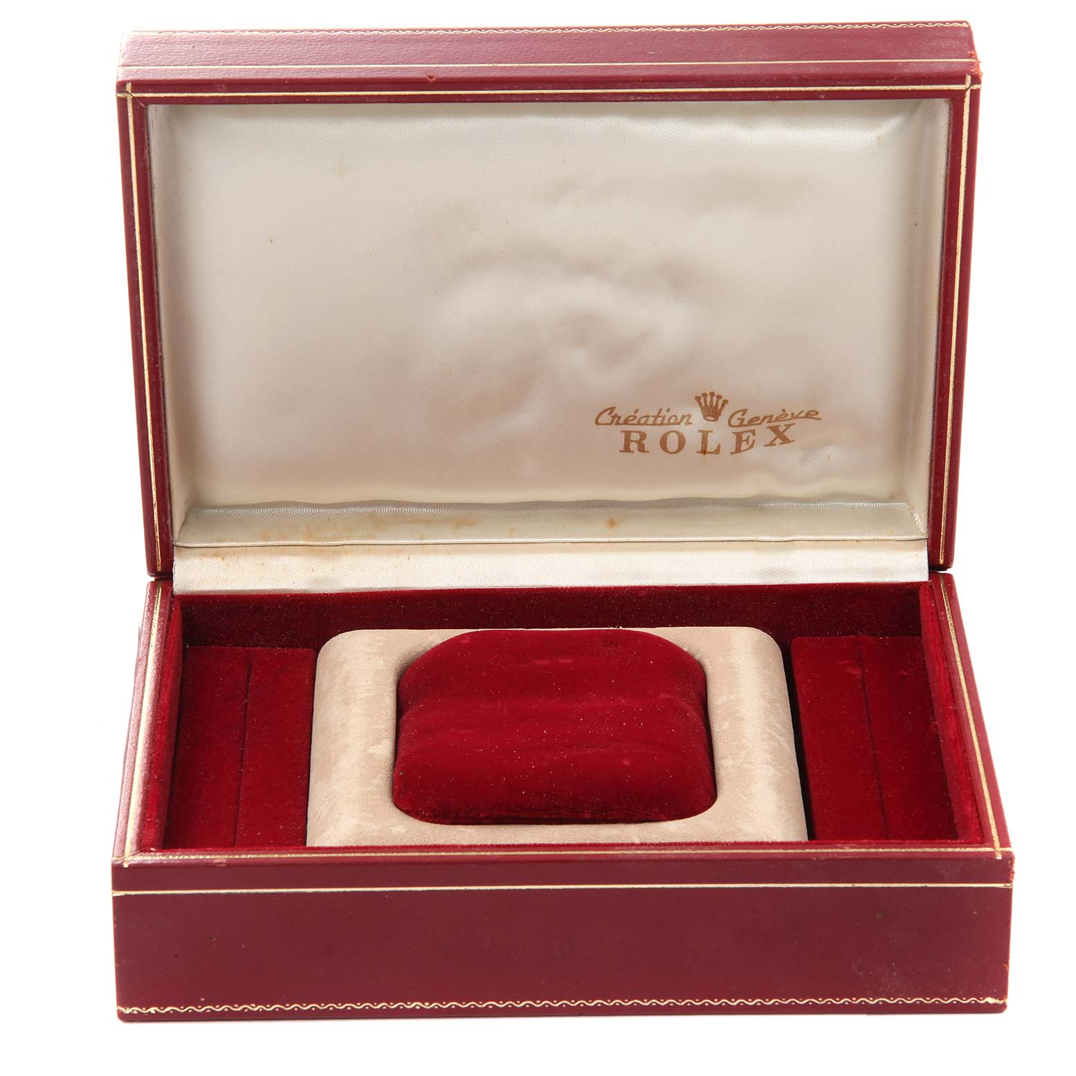 The image shows an open Rolex watch box for the President model, with a red velvet interior and cushion.