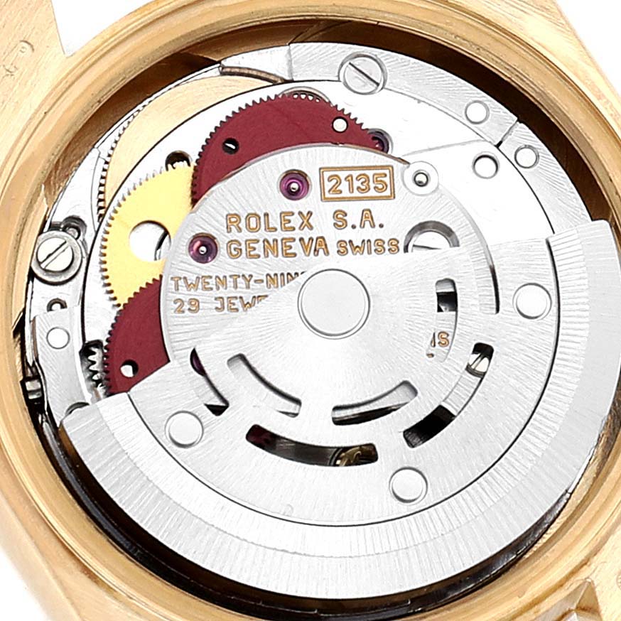 This image shows the internal mechanism of a Rolex President 69178 Women
s Yellow Gold Champagne Dial 69178 Women
s Yellow Gold Champagne Dial model watch, specifically showcasing its movement from a top-down angle.
