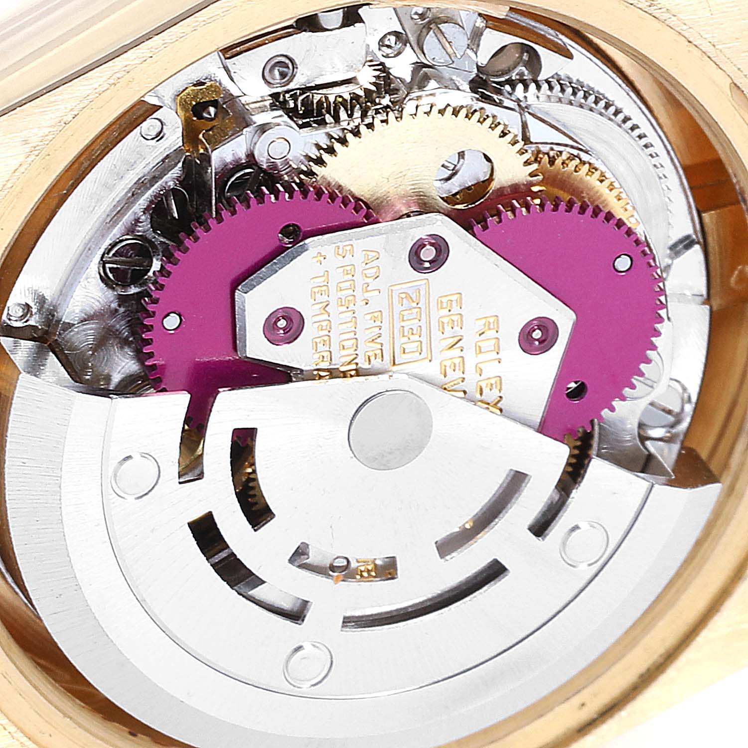 This image shows a close-up of the internal mechanism of a Rolex President 6900 Women
s Yellow Gold Silver Dial 6900 Women
s Yellow Gold Silver Dial model watch, highlighting gears and the rotor.