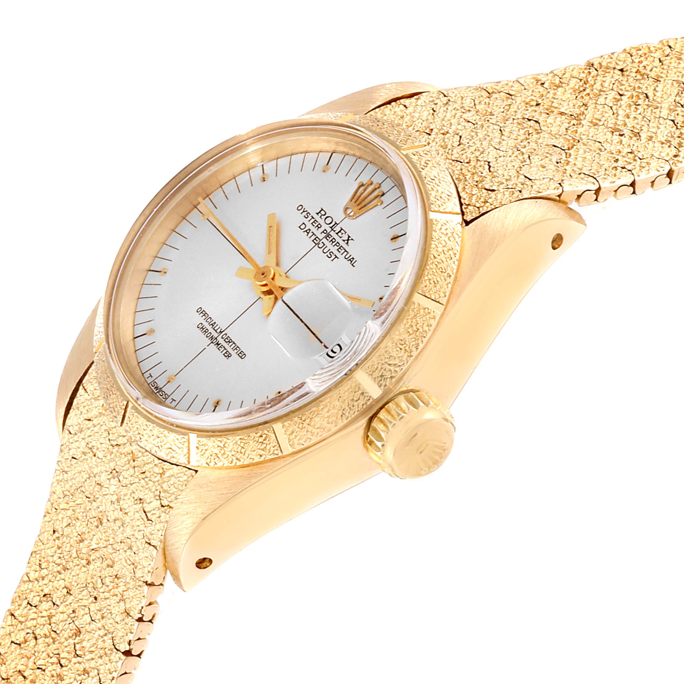 The image shows a close-up side angle of a Rolex President 6900 Women
s Yellow Gold Silver Dial 6900 Women
s Yellow Gold Silver Dial model watch, displaying its face, crown, and part of the textured band.