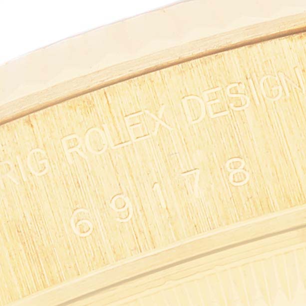 This close-up shot shows the caseback engraving on a Rolex President 69178 Women's Yellow Gold Mother of Pearl Dial 69178 Women's Yellow Gold Mother of Pearl Dial model watch.