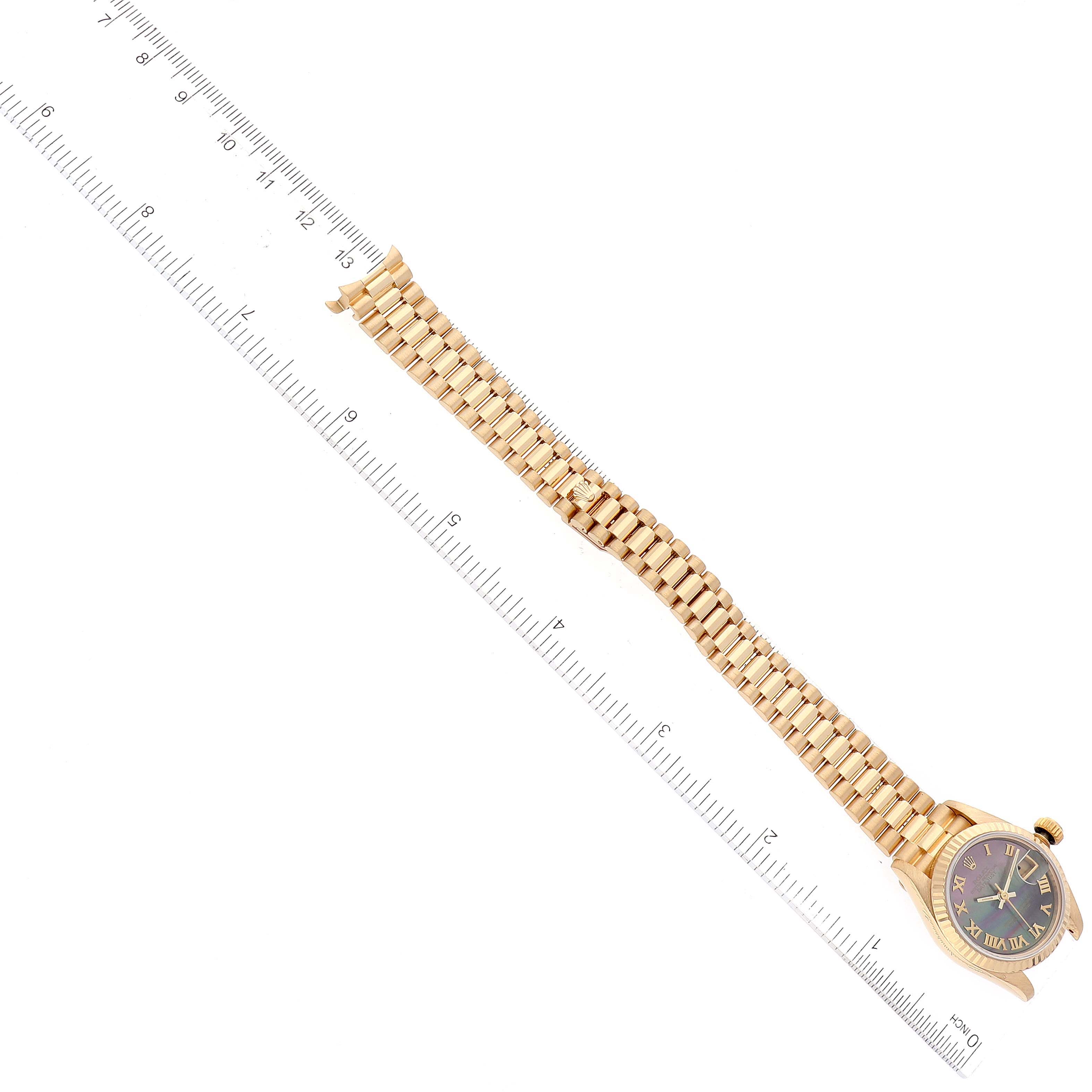 The Rolex President 69178 Women's Yellow Gold Mother of Pearl Dial 69178 Women's Yellow Gold Mother of Pearl Dial watch is shown from an overhead angle, displaying its gold bracelet and black dial.