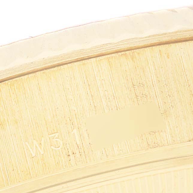 This image shows a close-up of the serial number engraving on a Rolex President 69178 Women's Yellow Gold Mother of Pearl Dial 69178 Women's Yellow Gold Mother of Pearl Dial model watch.