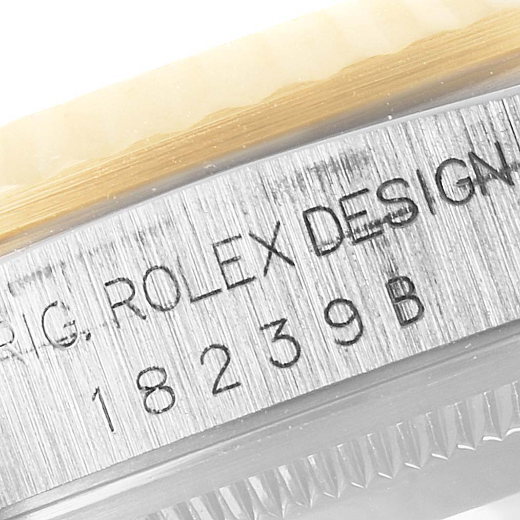 This image shows the side of the bezel and the serial number engraving on the case of a Rolex President 18239 Men
s White Gold Silver Dial 18239 Men
s White Gold Silver Dial model watch.