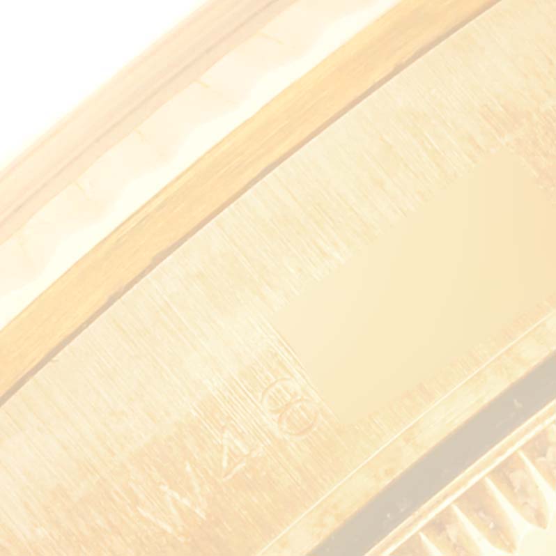 The image shows a close-up view of the bezel and part of the outer casing of a Rolex President 68278 Women's Yellow Gold Champagne Dial 68278 Women's Yellow Gold Champagne Dial model watch.