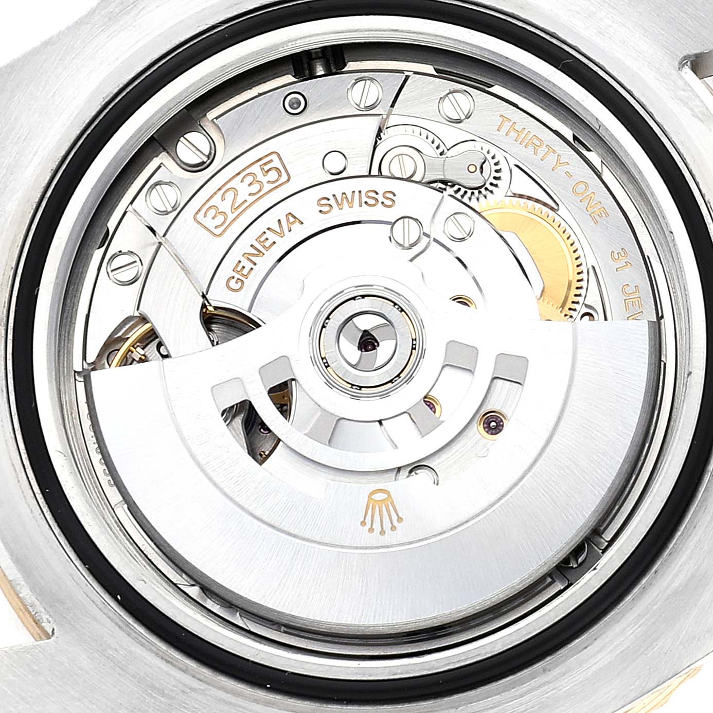 This close-up shot shows the movement mechanism of the Rolex Sea-Dweller 126603 Men
s Steel and Gold (two tone) Black Dial 126603 Men
s Steel and Gold (two tone) Black Dial watch including the rotor and inscriptions.
