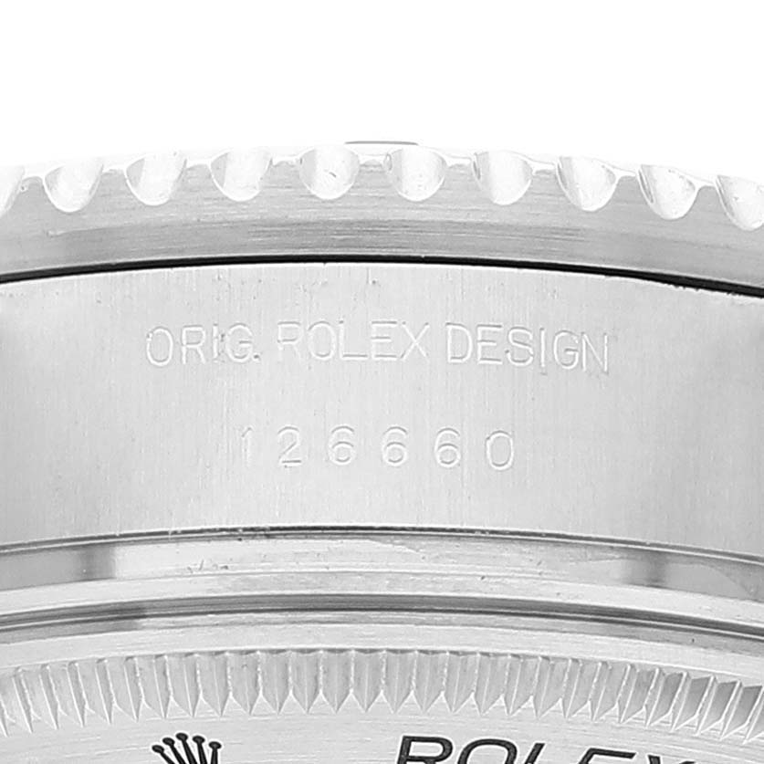 This image shows a close-up of the case back and bezel edge of a Rolex Sea-Dweller 126660 Men
s Stainless Steel Blue Dial 126660 Men
s Stainless Steel Blue Dial watch, including the model number 126660.