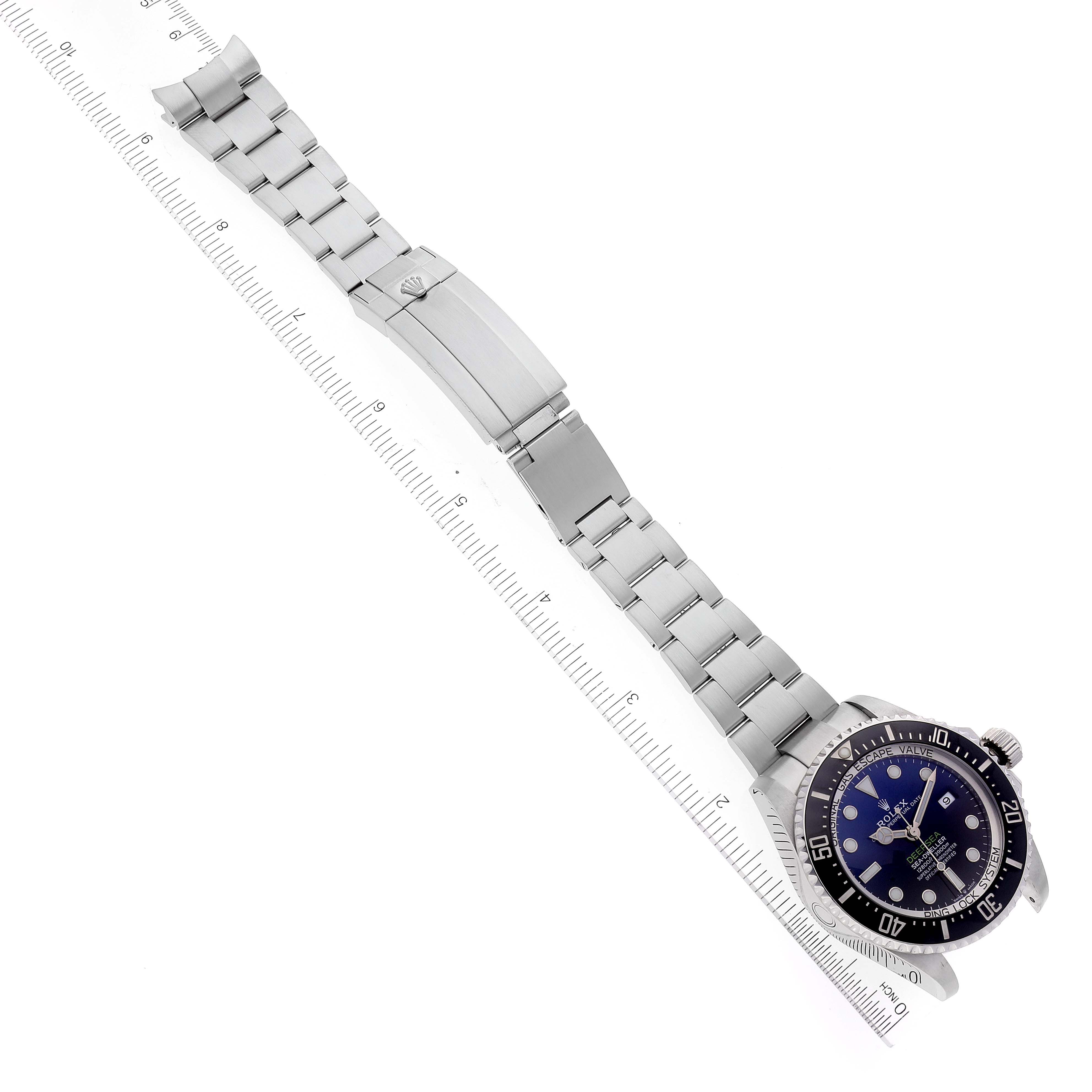 The Rolex Sea-Dweller 126660 Men
s Stainless Steel Blue Dial 126660 Men
s Stainless Steel Blue Dial watch is shown from an angled top view, displaying its bracelet, clasp, and watch face.