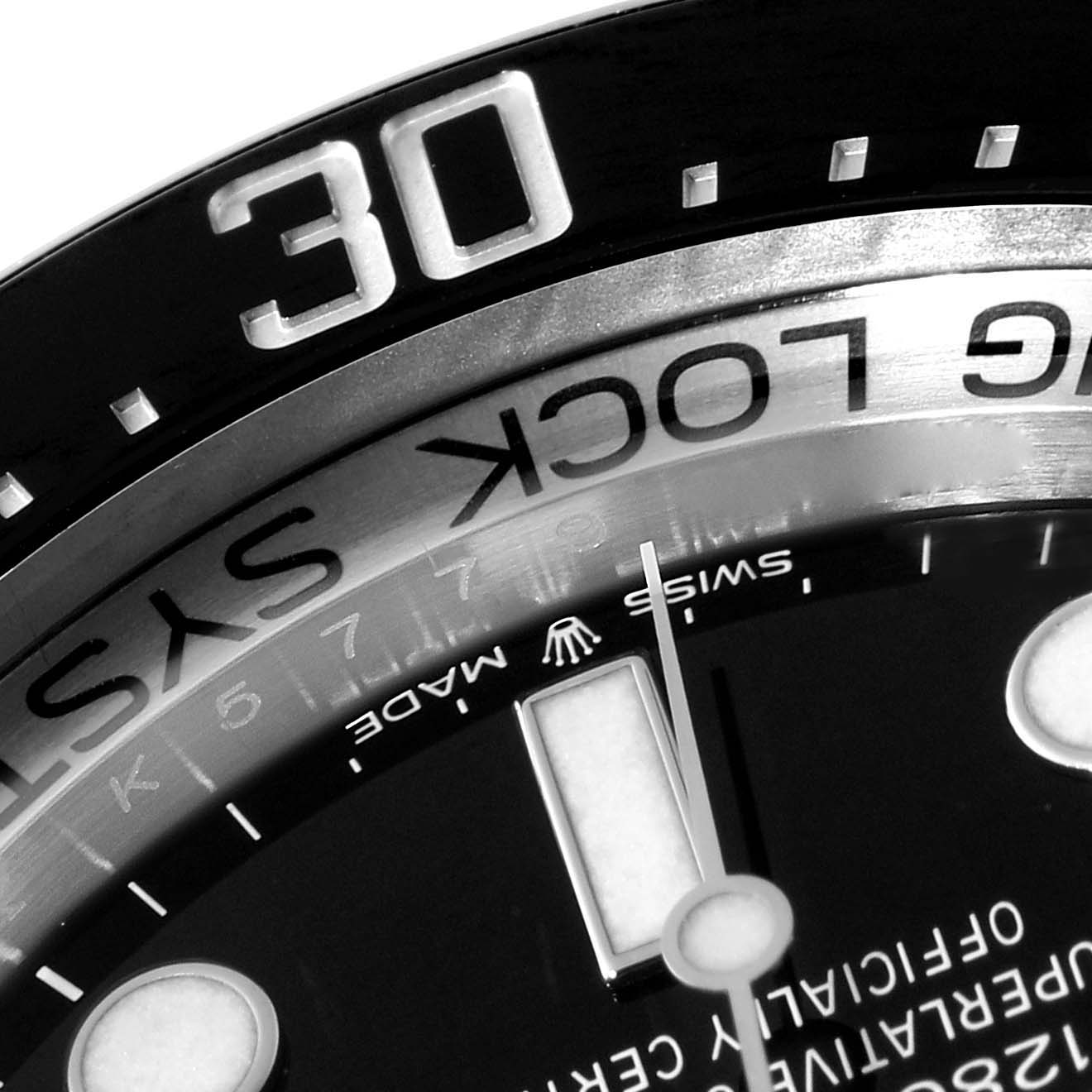 This close-up image of the Rolex Sea-Dweller 126660 Men
s Stainless Steel Blue Dial 126660 Men
s Stainless Steel Blue Dial watch showcases the bezel with the "30" marker and part of the dial, including the "SWISS MADE" text.