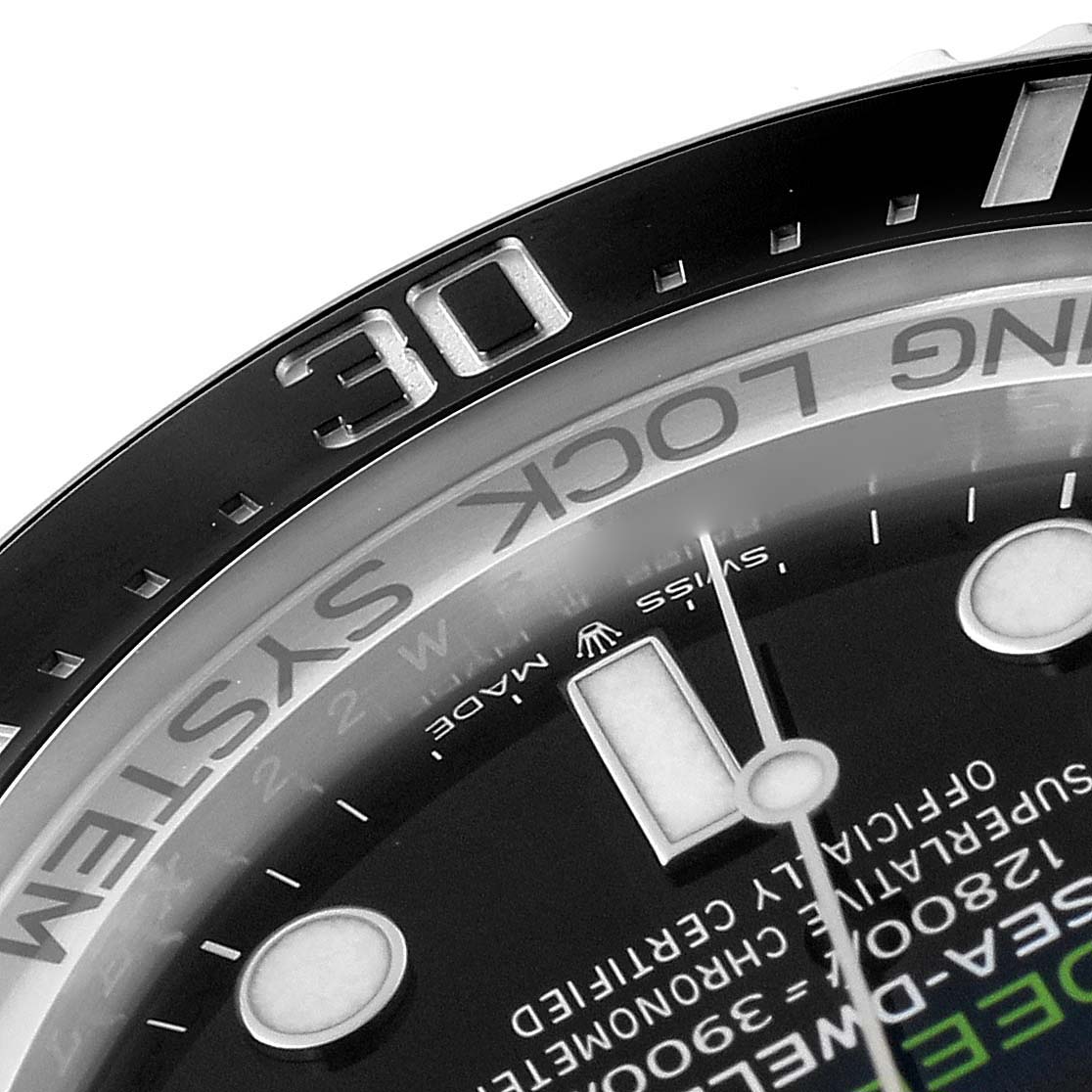 This is a close-up of the bezel and part of the dial of a Rolex Sea-Dweller 126660 Men
s Stainless Steel Blue Dial 126660 Men
s Stainless Steel Blue Dial watch showing the number "30" and the words "RING LOCK SYSTEM."