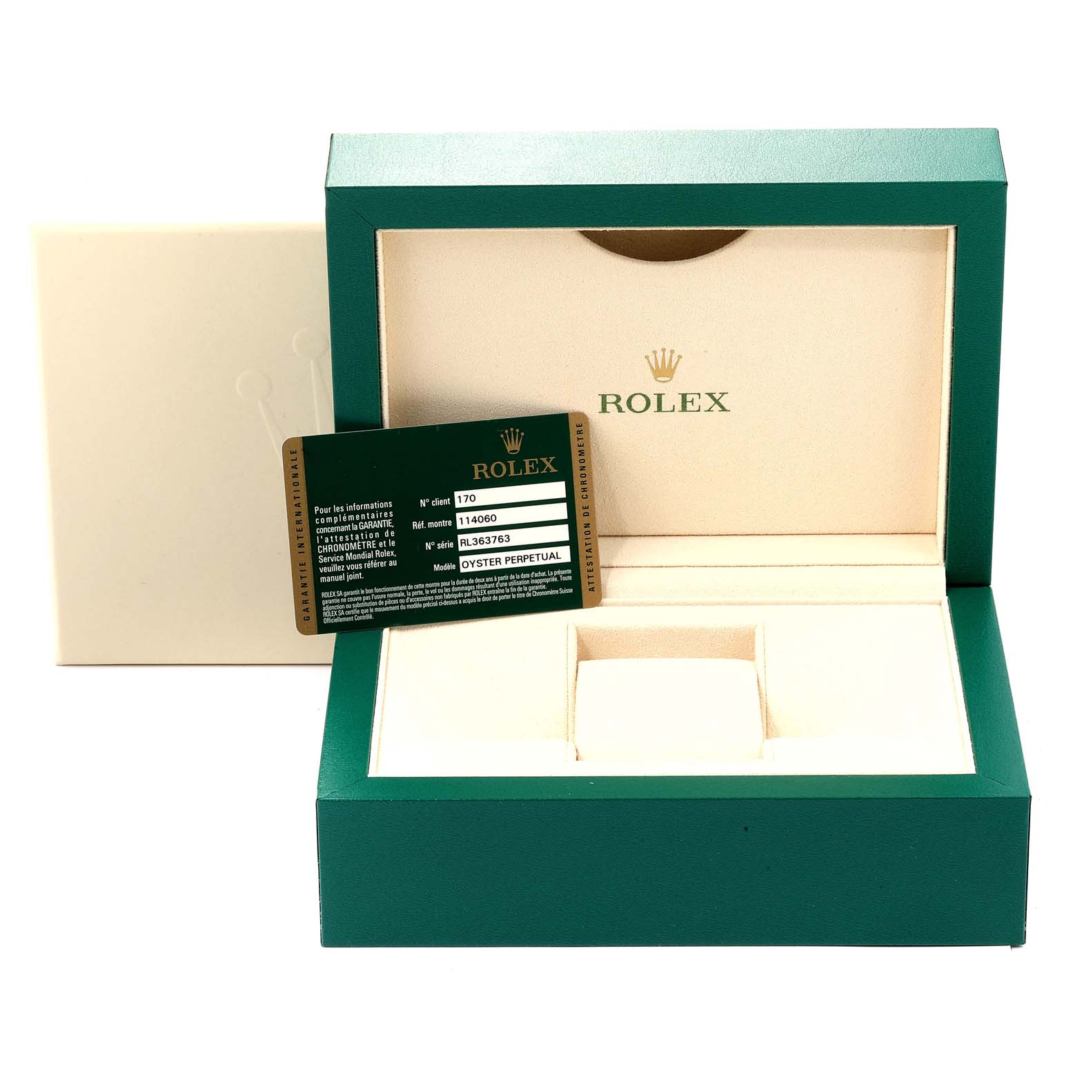The image shows the open green box, beige inner cushion, cardholder, and warranty card for the Rolex Submariner 114060 Men
s Stainless Steel Black Dial 114060 Men
s Stainless Steel Black Dial model.