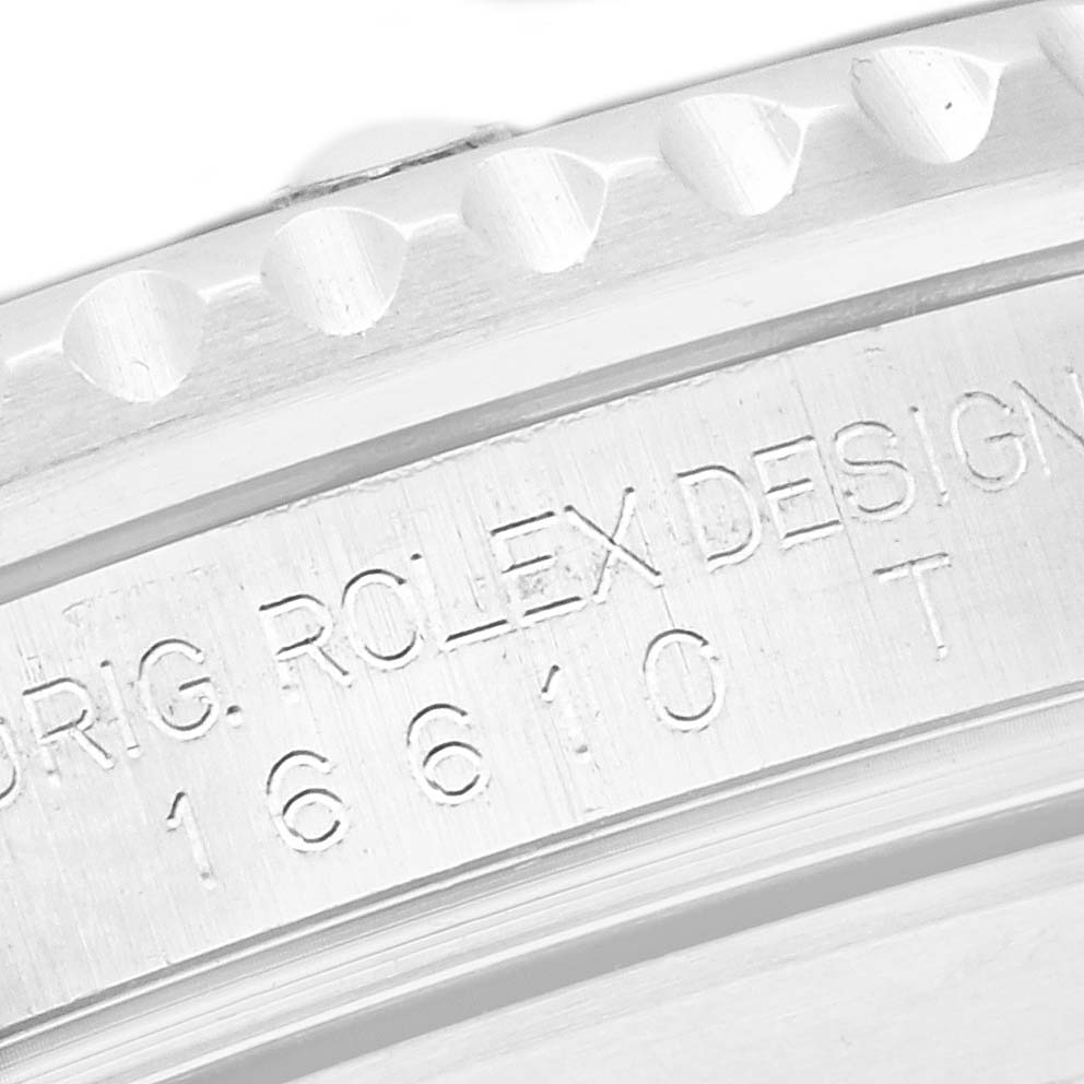 The image shows a close-up of the Rolex Submariner 16610 Men
s Stainless Steel Black Dial 16610 Men
s Stainless Steel Black Dial
s case side, featuring the engraved model number and design details.