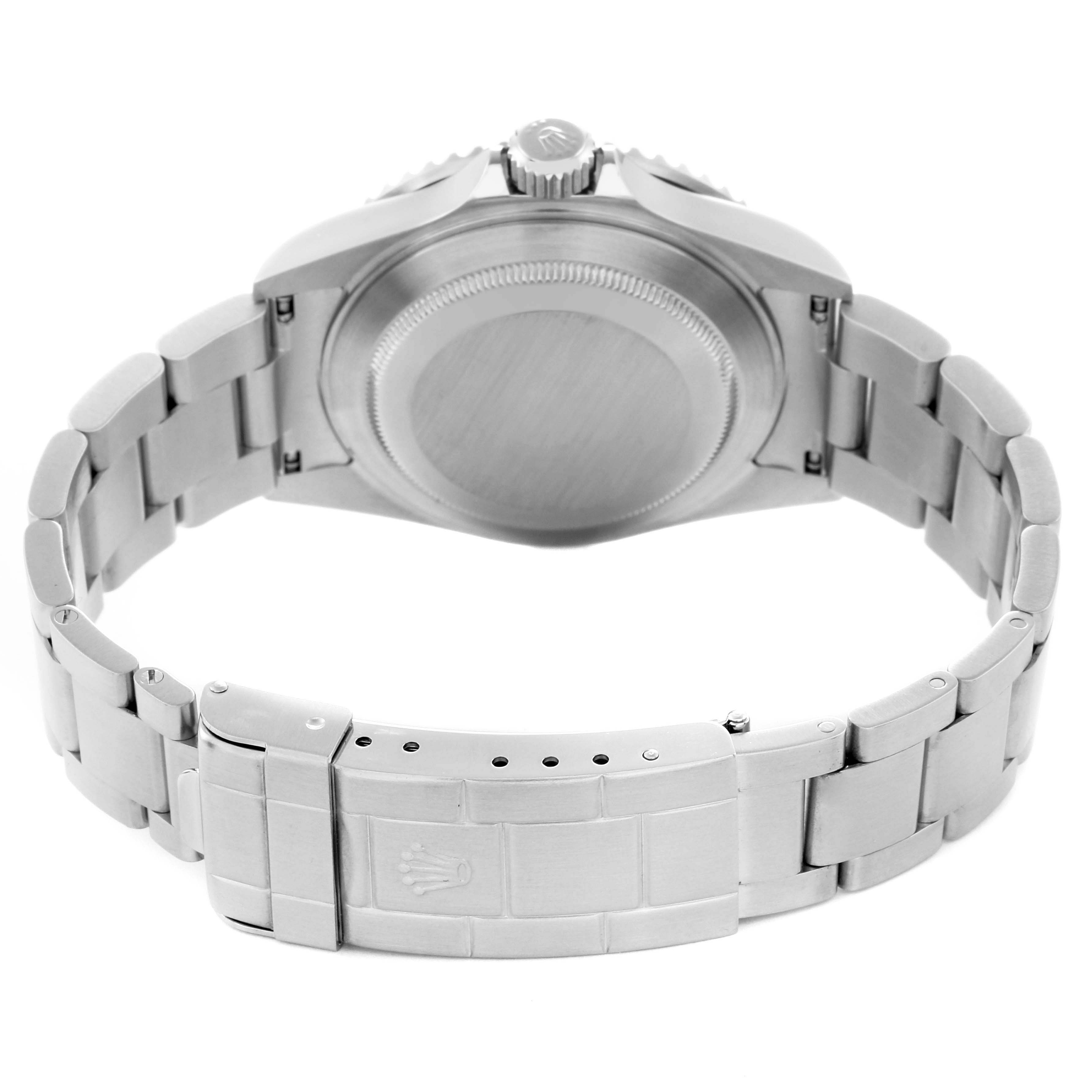 The image shows a rear view of a Rolex Submariner 16610 Men
s Stainless Steel Black Dial 16610 Men
s Stainless Steel Black Dial with an open stainless steel bracelet and visible case back.