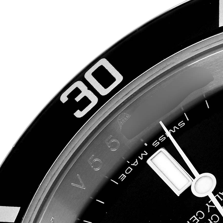 The image shows a close-up of the bezel and dial of a Rolex Submariner 16610 Men
s Stainless Steel Black Dial 16610 Men
s Stainless Steel Black Dial, focusing on the 30-minute mark.