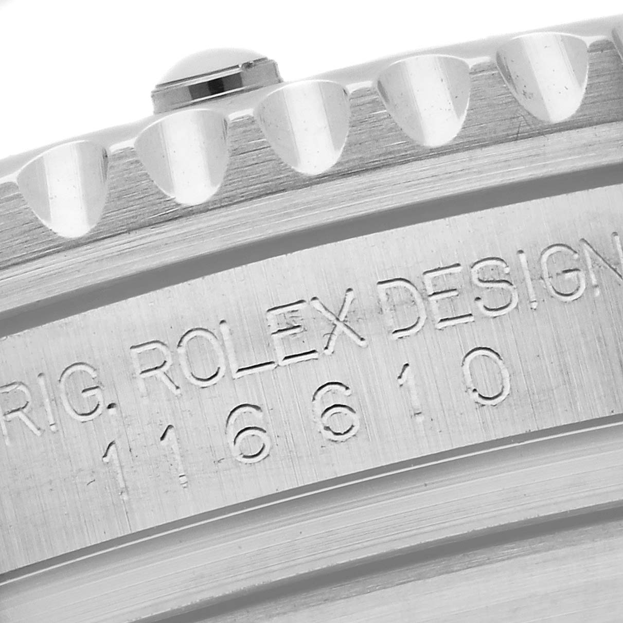 This close-up image shows the engraved serial number and bezel teeth of the Rolex Submariner 116610 Men
s Stainless Steel Black Dial 116610 Men
s Stainless Steel Black Dial watch.