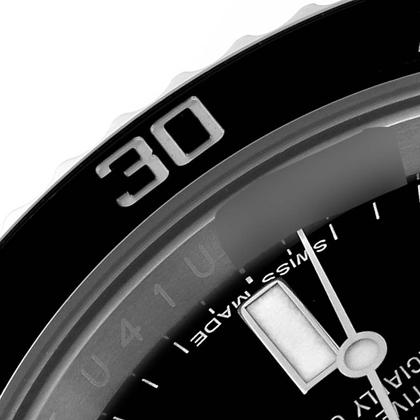 This image features a close-up of the bezel, dial, and minute hand of a Rolex Submariner 116610 Men
s Stainless Steel Black Dial 116610 Men
s Stainless Steel Black Dial watch, showing the "30" minute mark.