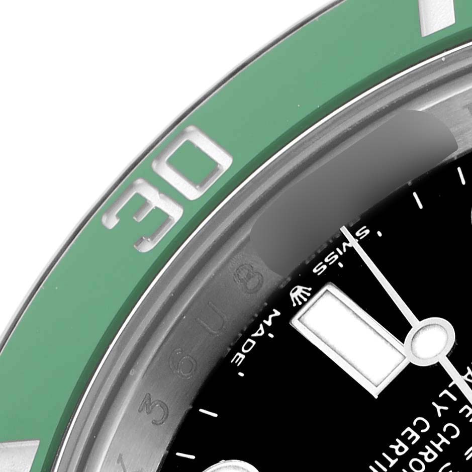 The image shows a close-up of the Rolex Submariner 126610LV Men
s Stainless Steel Black Dial 126610LV Men
s Stainless Steel Black Dial
s green bezel and part of the black dial with hands and markers visible.