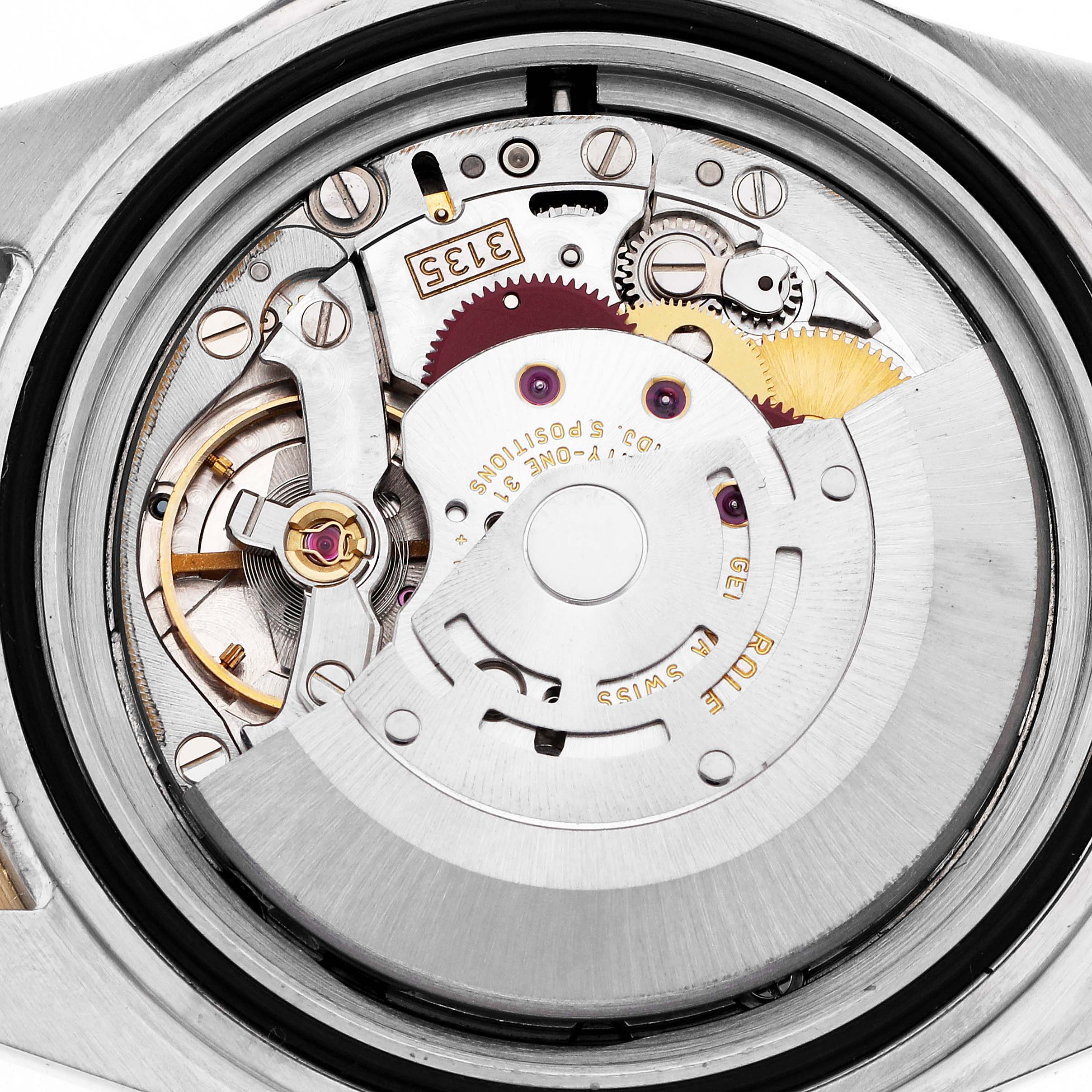 The image shows the movement mechanism of a Rolex Submariner 16613 Men
s Steel and Gold (two tone) Black Dial 16613 Men
s Steel and Gold (two tone) Black Dial watch from a top-down angle.