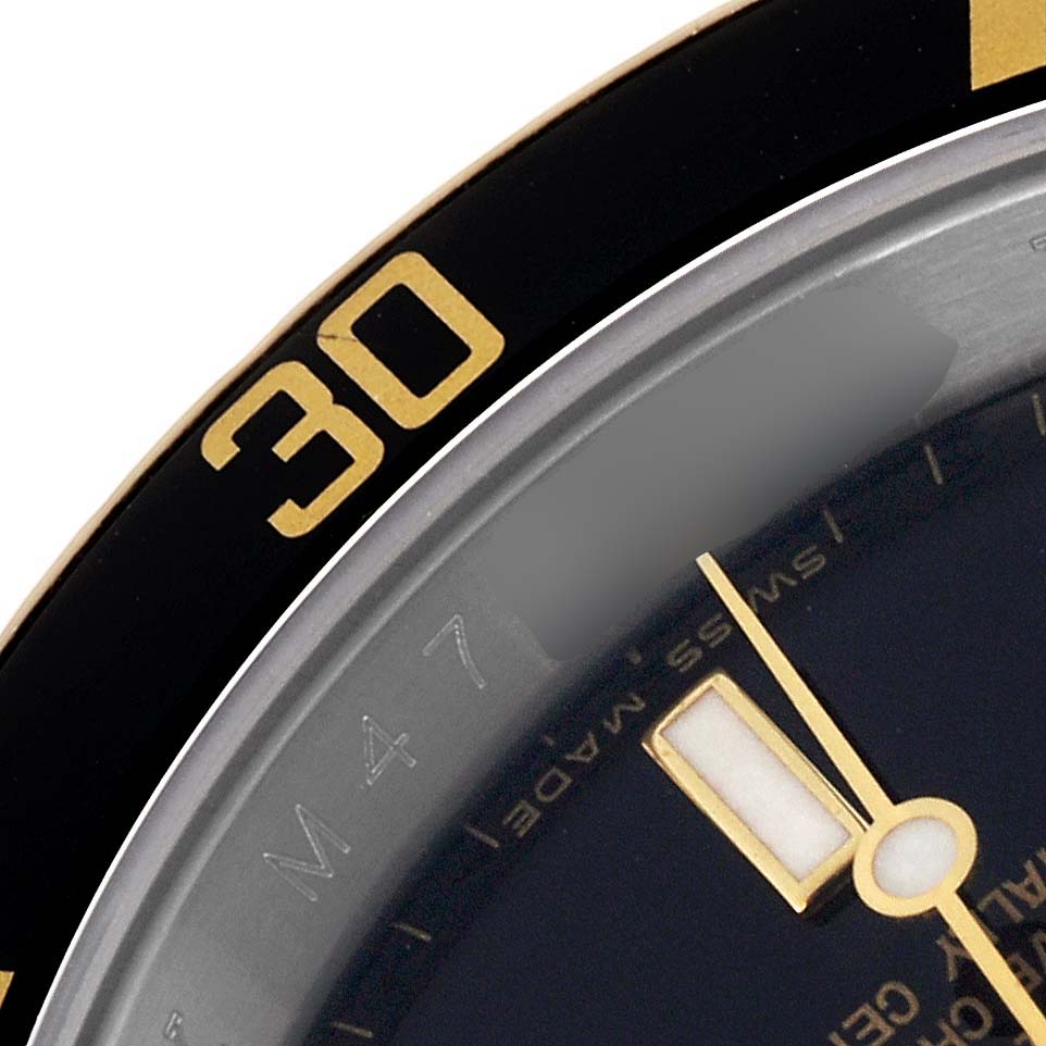 The image shows a close-up of the bezel and dial of a Rolex Submariner 16613 Men
s Steel and Gold (two tone) Black Dial 16613 Men
s Steel and Gold (two tone) Black Dial, highlighting the "30" marker and minute hand.