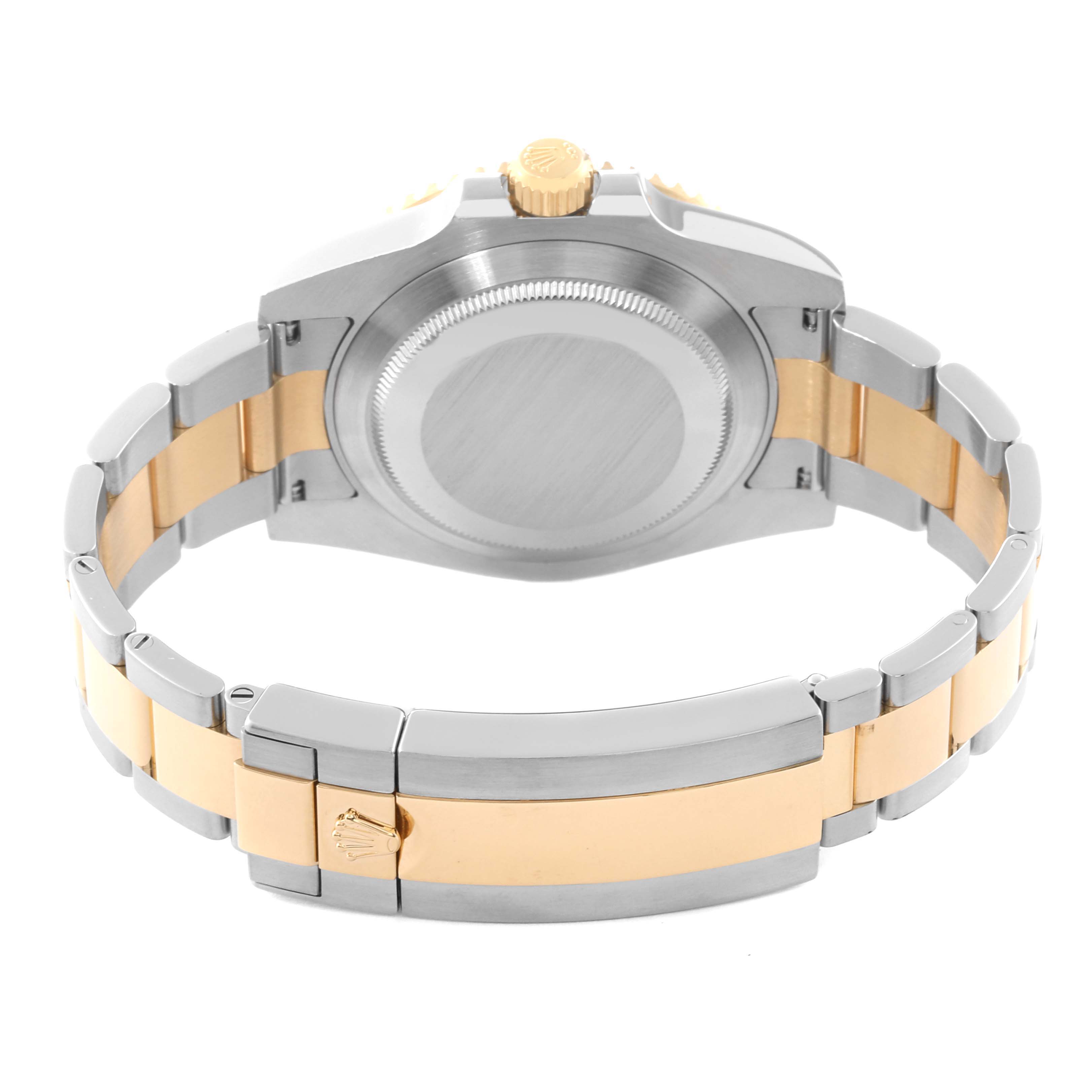 The image shows the back and clasp of a Rolex Submariner 116613 Men's Steel and Gold (two tone) Blue Dial 116613 Men's Steel and Gold (two tone) Blue Dial watch, highlighting its two-tone metal bracelet.