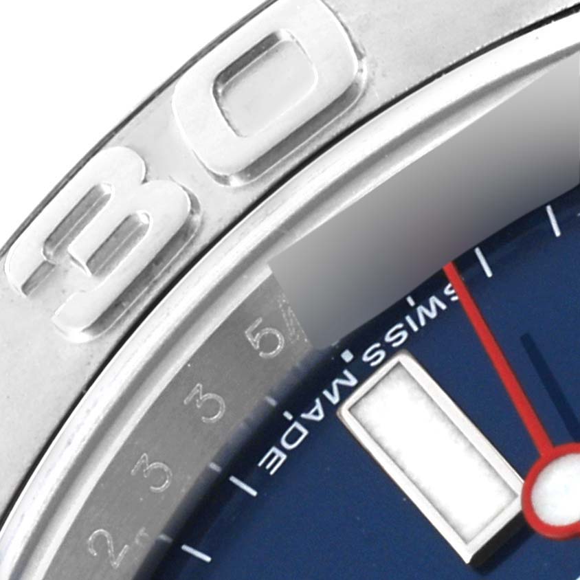 This close-up image of a Rolex Yacht-Master 116622 Men's Stainless Steel Blue Dial 116622 Men's Stainless Steel Blue Dial watch shows part of the bezel, dial, and hour markers.