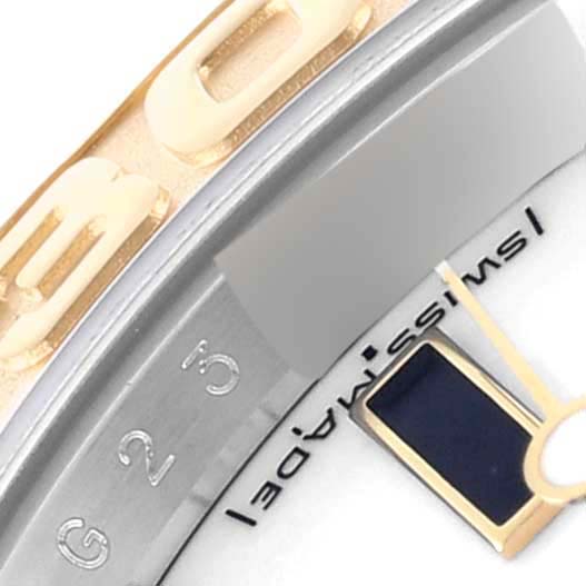 The image shows a close-up angle of the Rolex Yacht-Master 16623 Men's Steel and Gold (two tone) White Dial bezel, highlighting the engraved numerals.