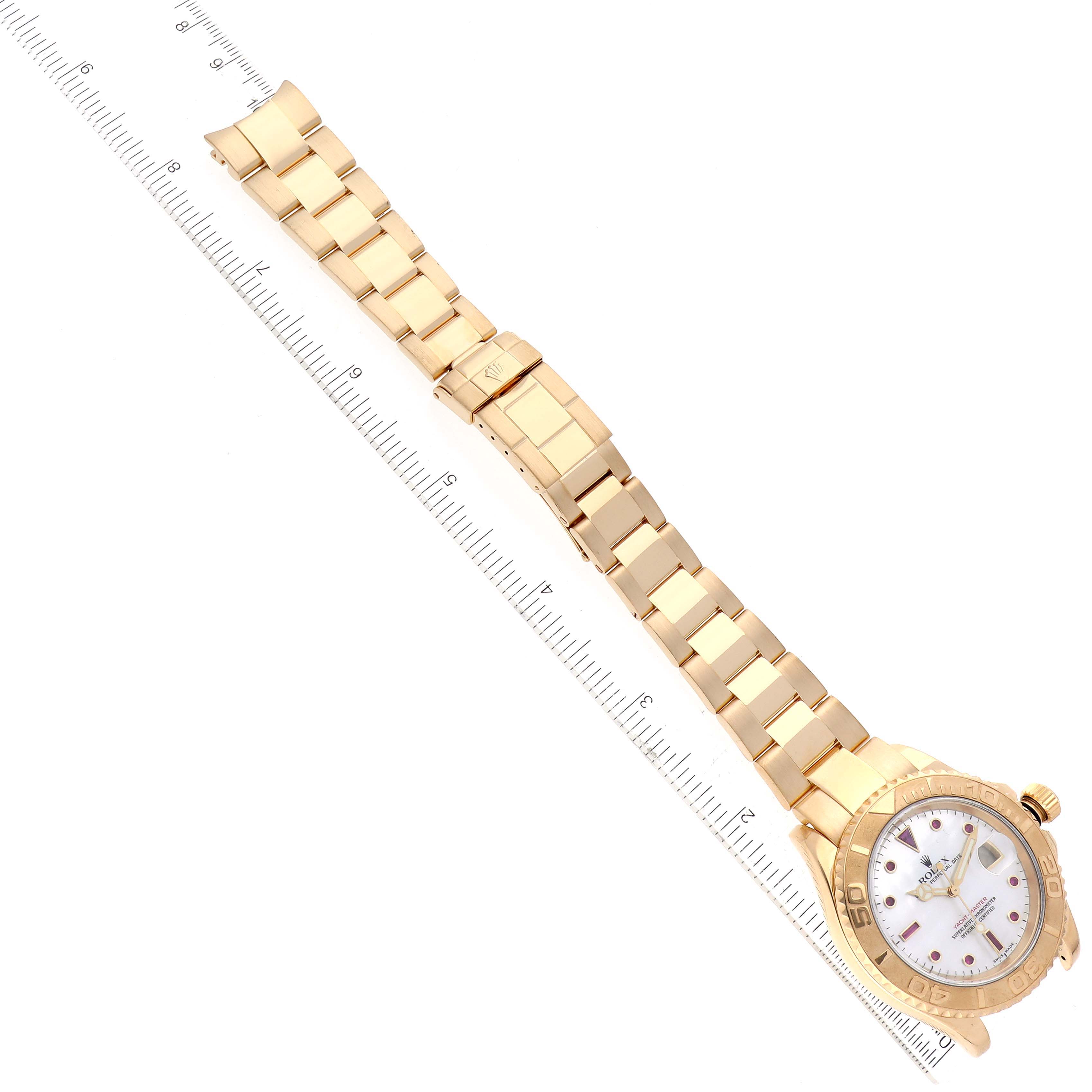 The image shows a top-down view of a Rolex Yacht-Master 16628 Men's Yellow Gold Mother of Pearl Dial 16628 Men's Yellow Gold Mother of Pearl Dial watch, highlighting its gold bracelet and dial.