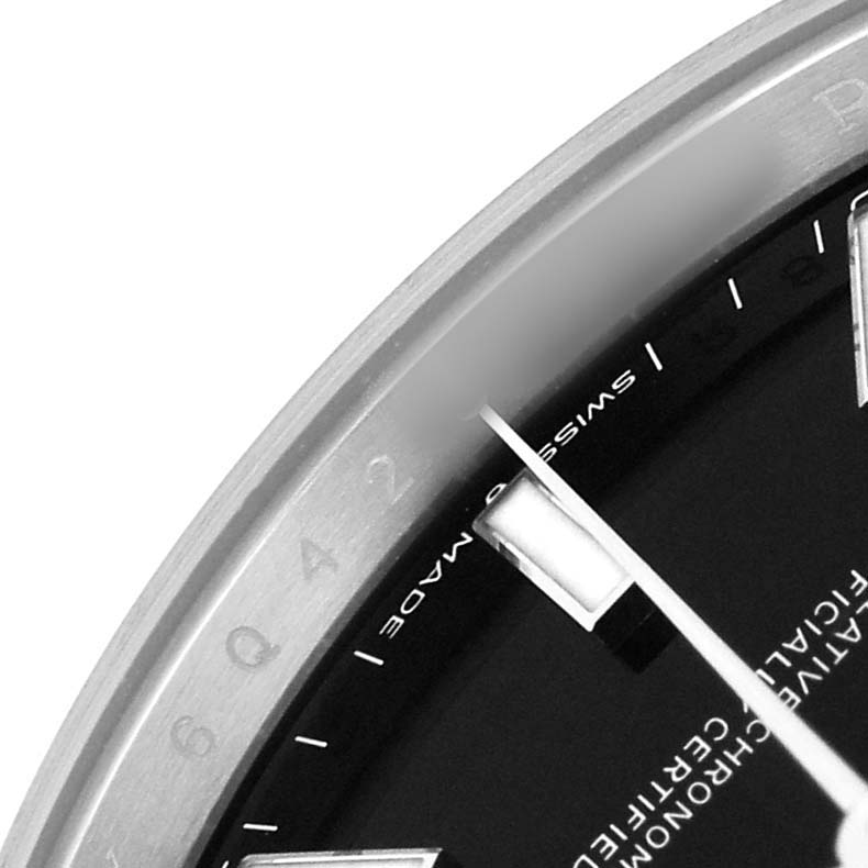 The image shows a close-up of the dial, bezel, and indices of a Rolex Datejust 41 126300 Men's Stainless Steel Black Dial, photographed from the side.