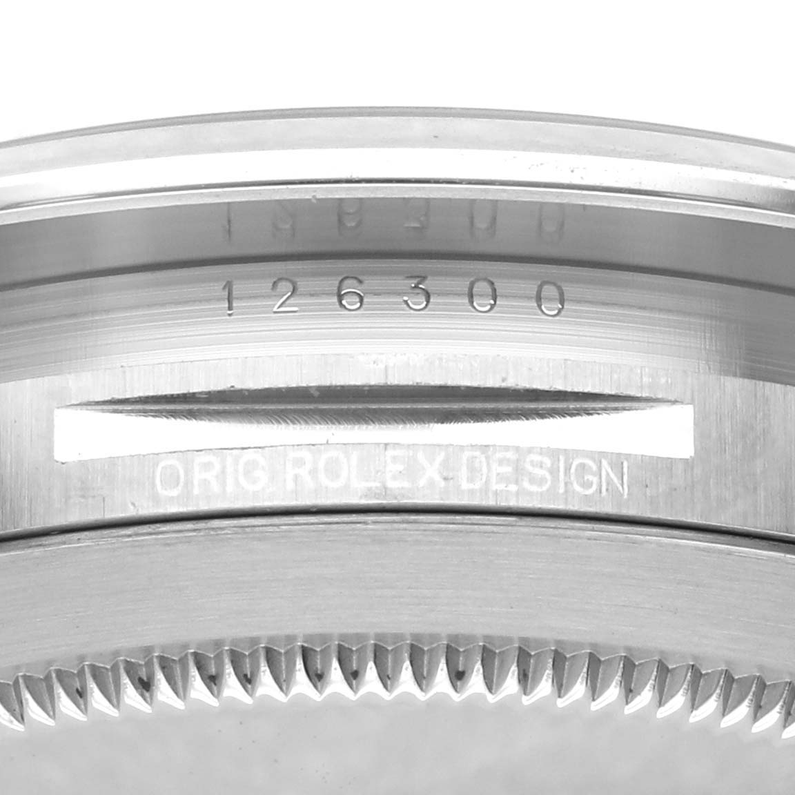 The image shows a close-up of the edge and engraved details on the case of a Rolex Datejust 41 126300 Men's Stainless Steel Black Dial watch.