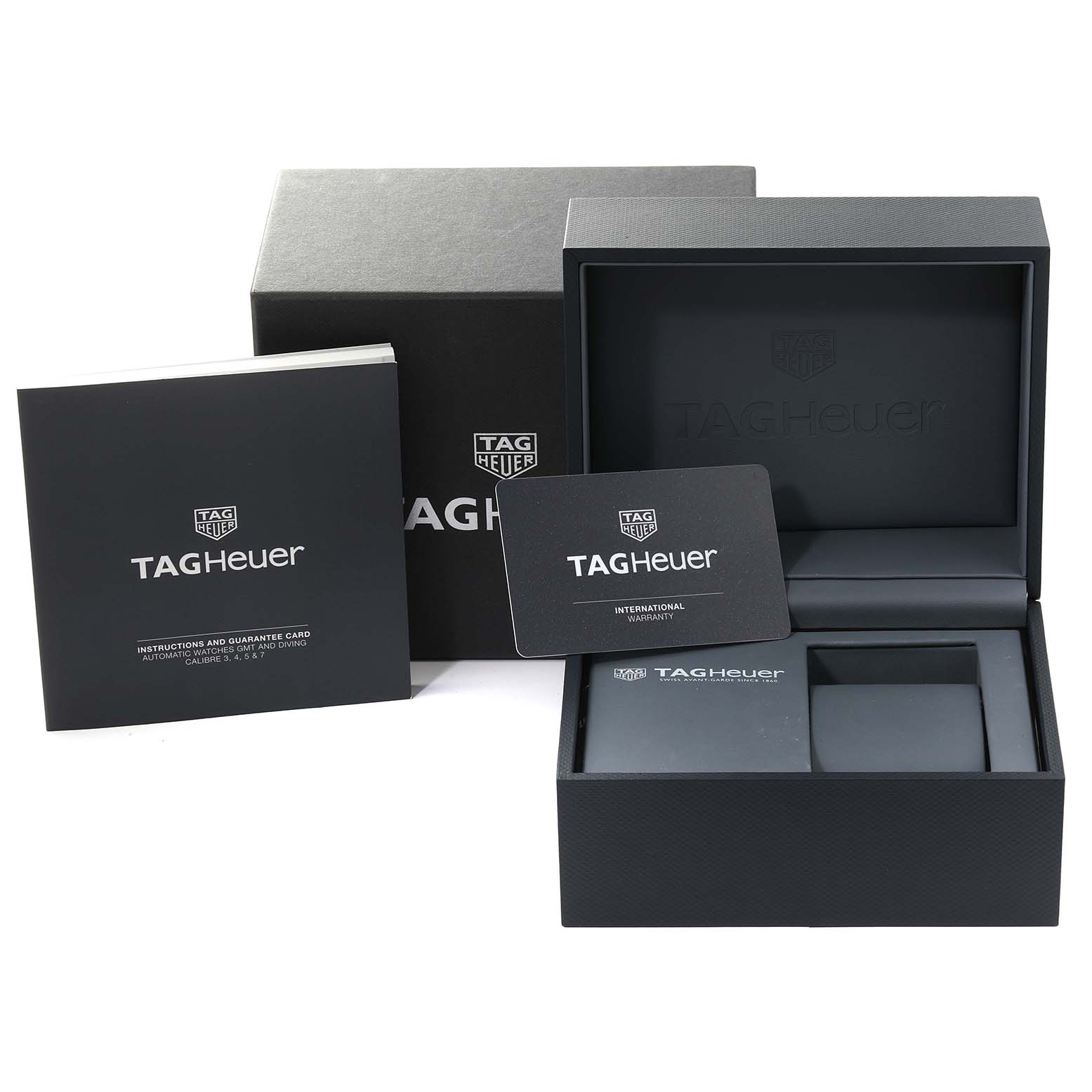 The image shows the packaging and accessories for the Tag Heuer Aquaracer WAY208F.BF0638 Men's Titanium Black Dial WAY208F.BF0638 Men's Titanium Black Dial, including the box, warranty card, and instruction booklet.